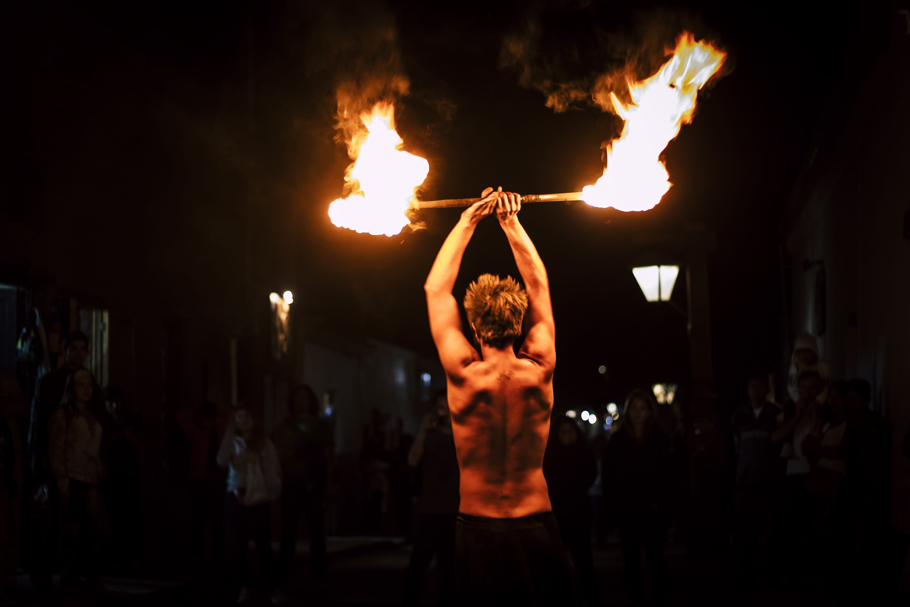 man, standing, fire, rear view, men, man holding fire, arms raised, dark, human limb, one person, night, flame, shirtless, adult, 2K, human body part, HD Wallpaper