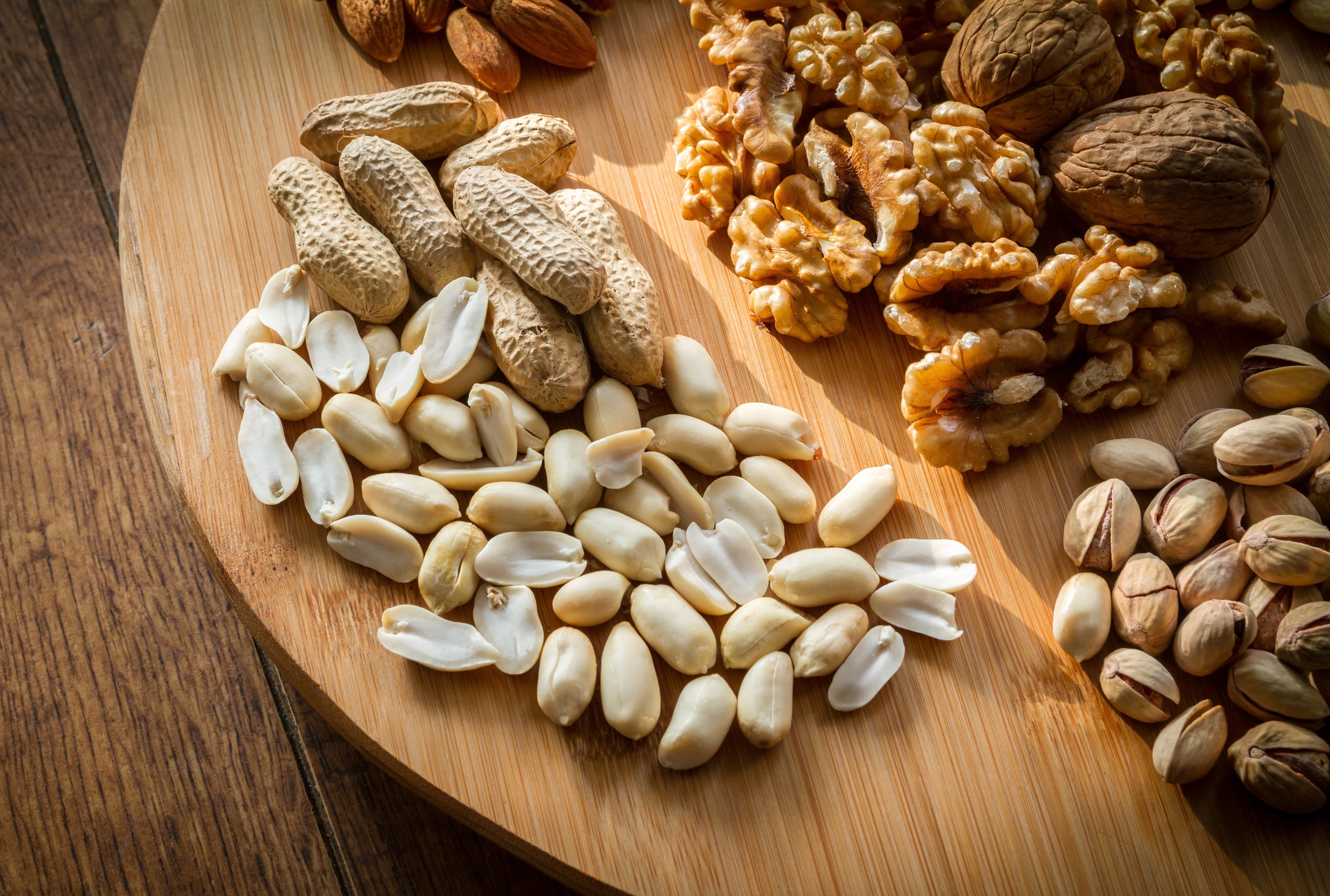 almonds, food and drink, wooden, table, eating, still life, breakfast cereal, variation, shell, plate, cashew, 4K, almond, selection, nut, indoors, tasty, HD Wallpaper