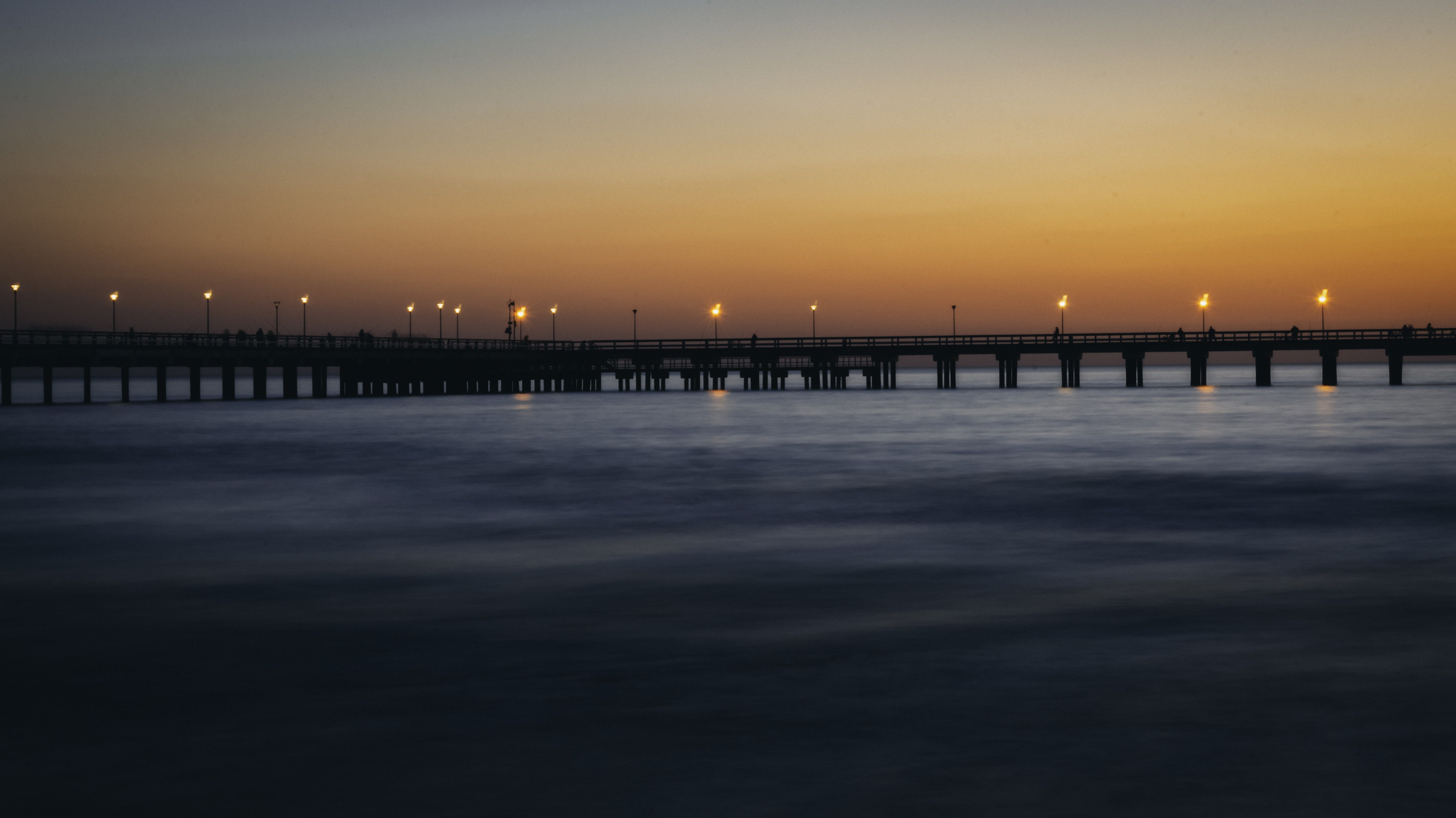 nature, silhouette, outdoor lights, water, architecture, evening, no people, travel, built structure, bridge, yellow sky, sea, idyllic, orange color, sunset, HD Wallpaper