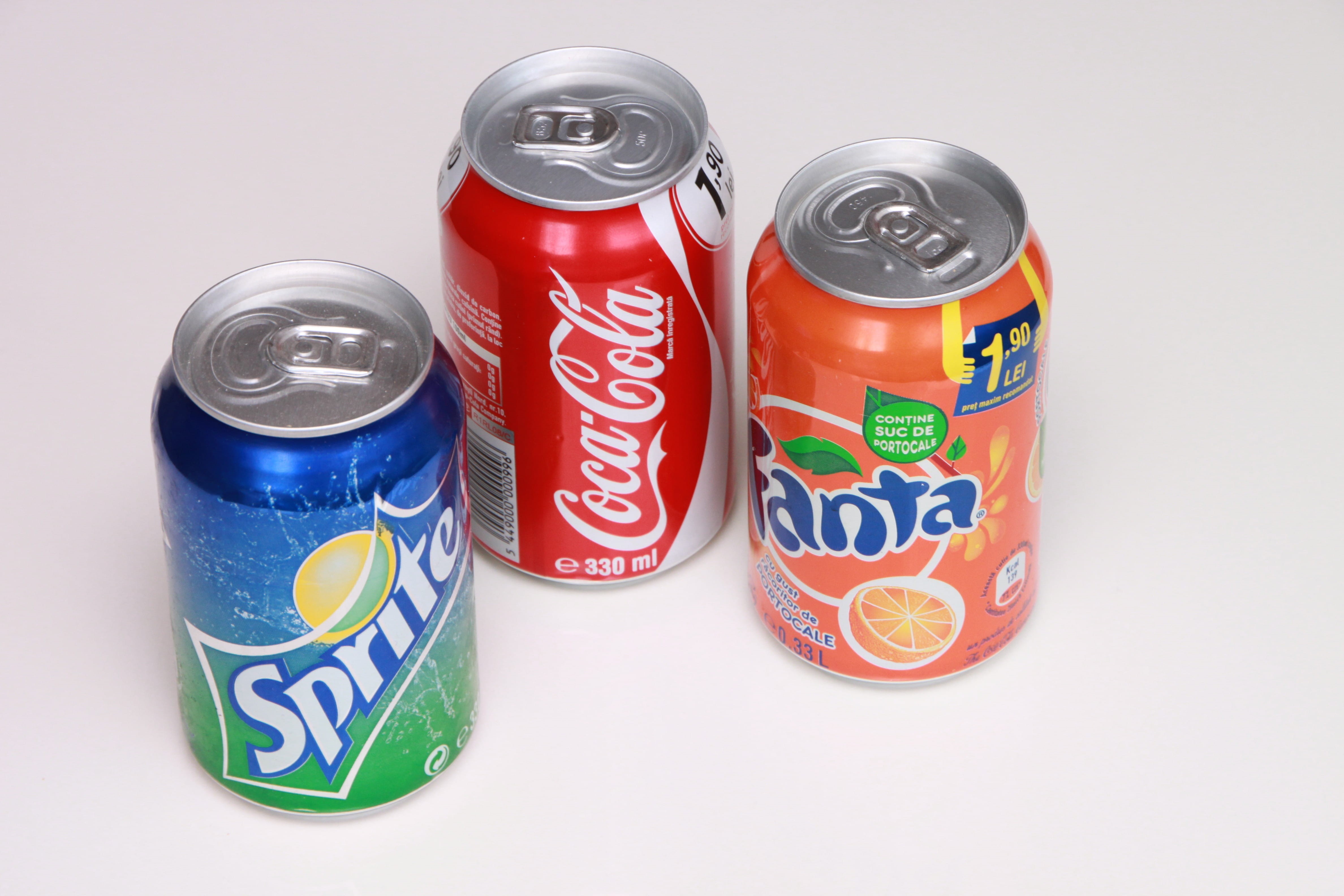 Cola, aluminum, food and drink, refreshment, metal, canned food, cup, coca, indoors, cola, Cola, high angle view, lemon, multi colored, food, orange, day, HD Wallpaper