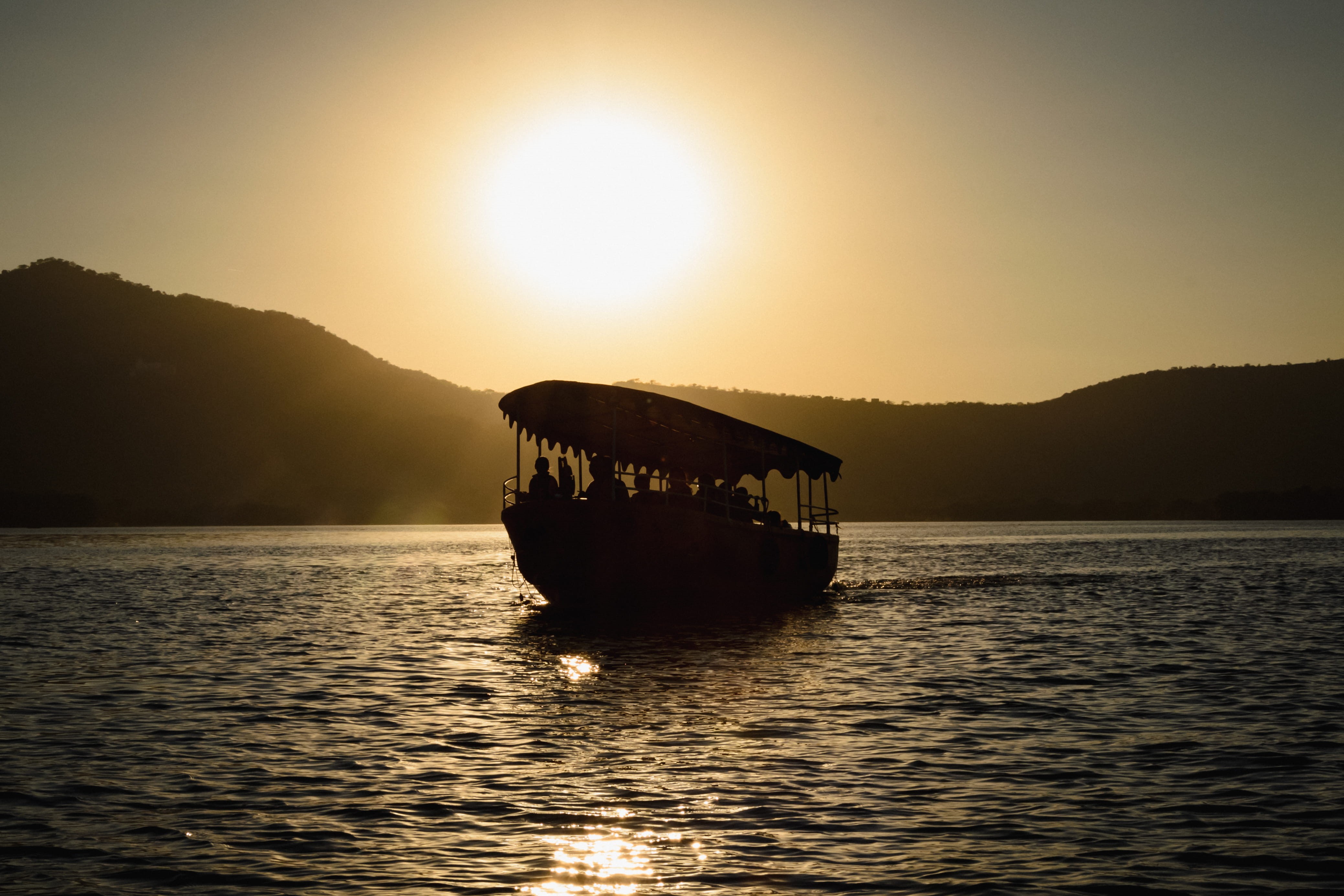 sunlight, passenger craft, mountain, scenics - nature, outdoors, silhouette, nature, sky, lake, transportation, orange, rajasthan, boat, tranquility, sea, HD Wallpaper