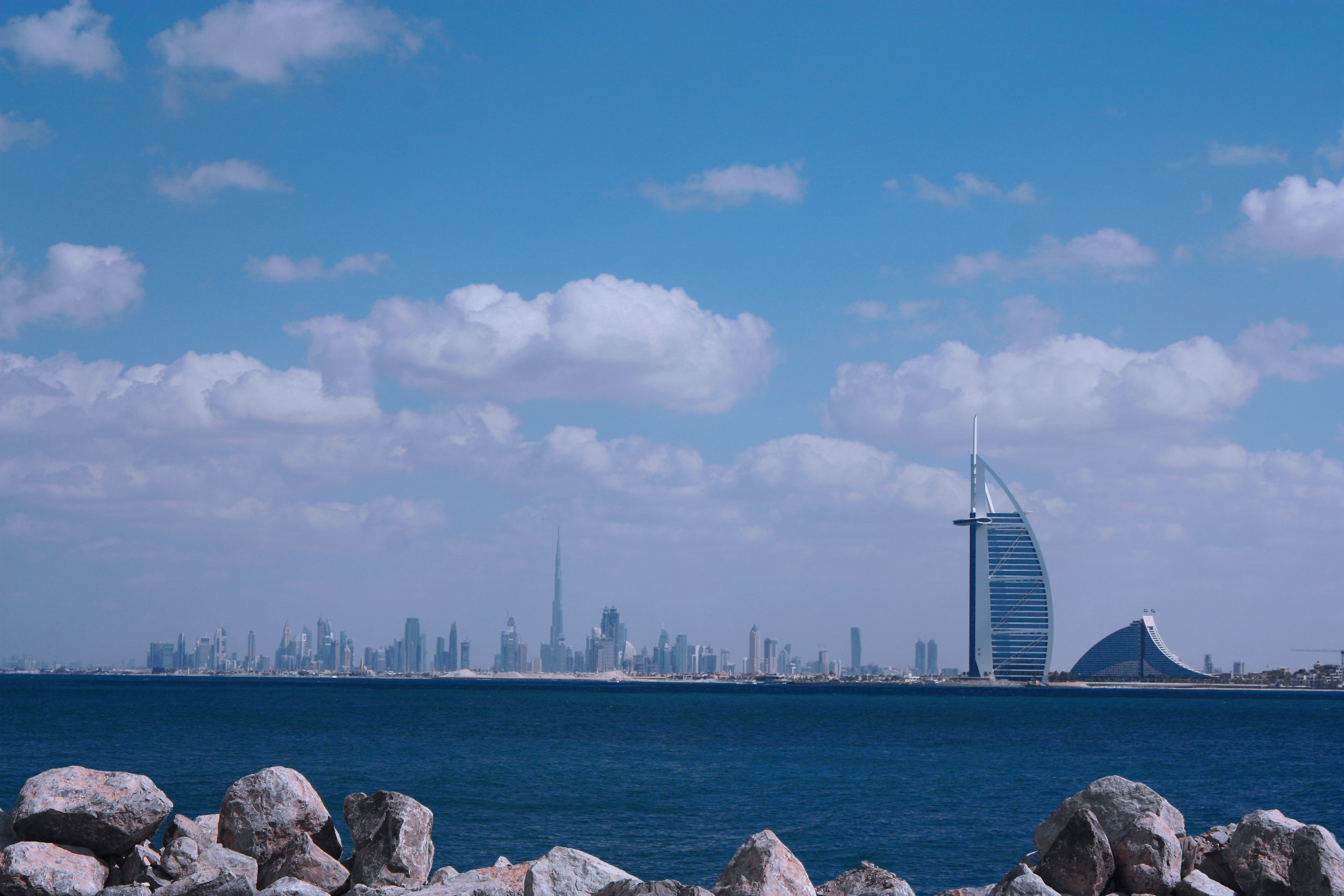 sea, day, building exterior, no people, 4K, travel, dubai, cloud - sky, office building exterior, cityscape, nature, transportation, water, al, city, architecture, HD Wallpaper