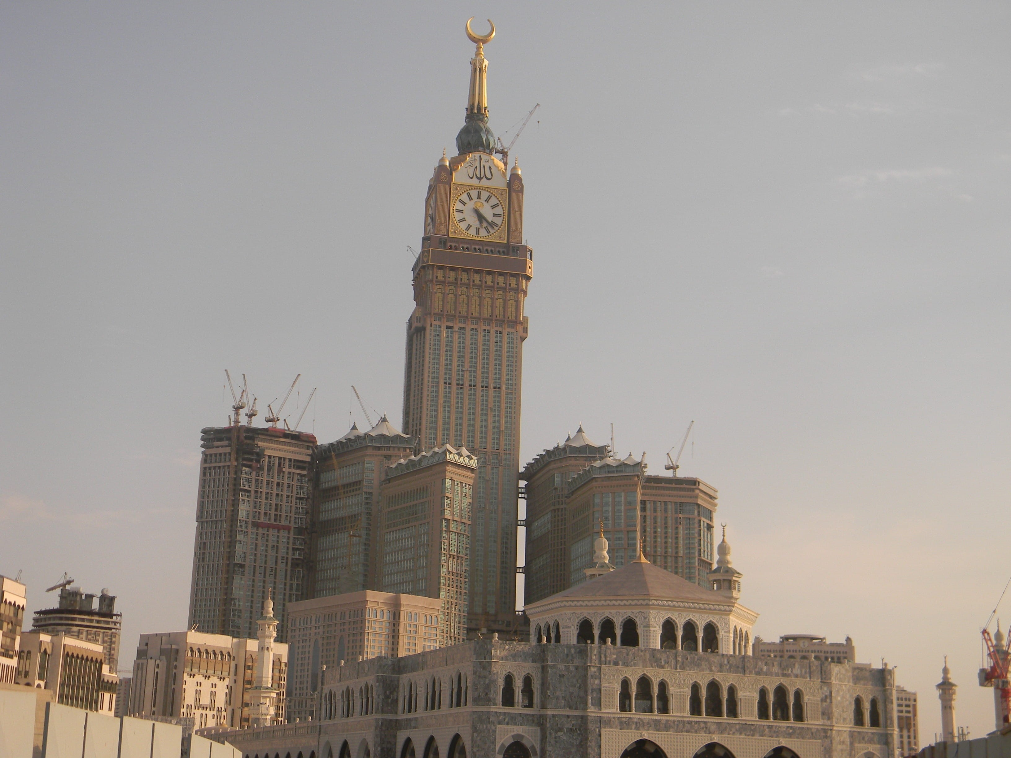 office building exterior, spire, clock, nature, travel destinations, built Structure, al abrar mecca, outdoors, 2K, urban Scene, architecture, cityscape, HD Wallpaper