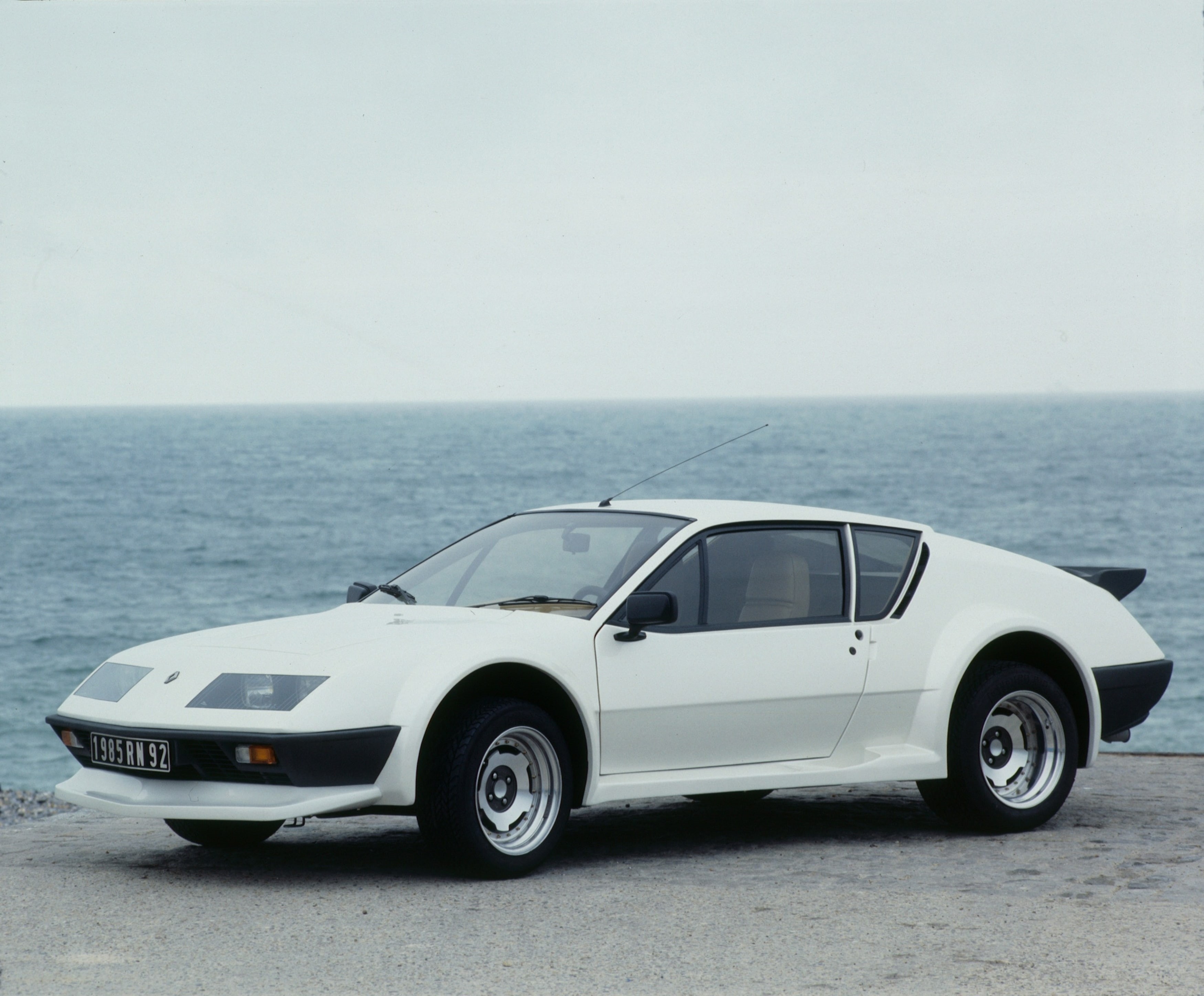 land vehicle, clear sky, 2K, car, day, copy space, sky, outdoors, v-6, 1983, nature, supercar, no people, horizon, renault, sea, luxury, a310, water, wheel, HD Wallpaper