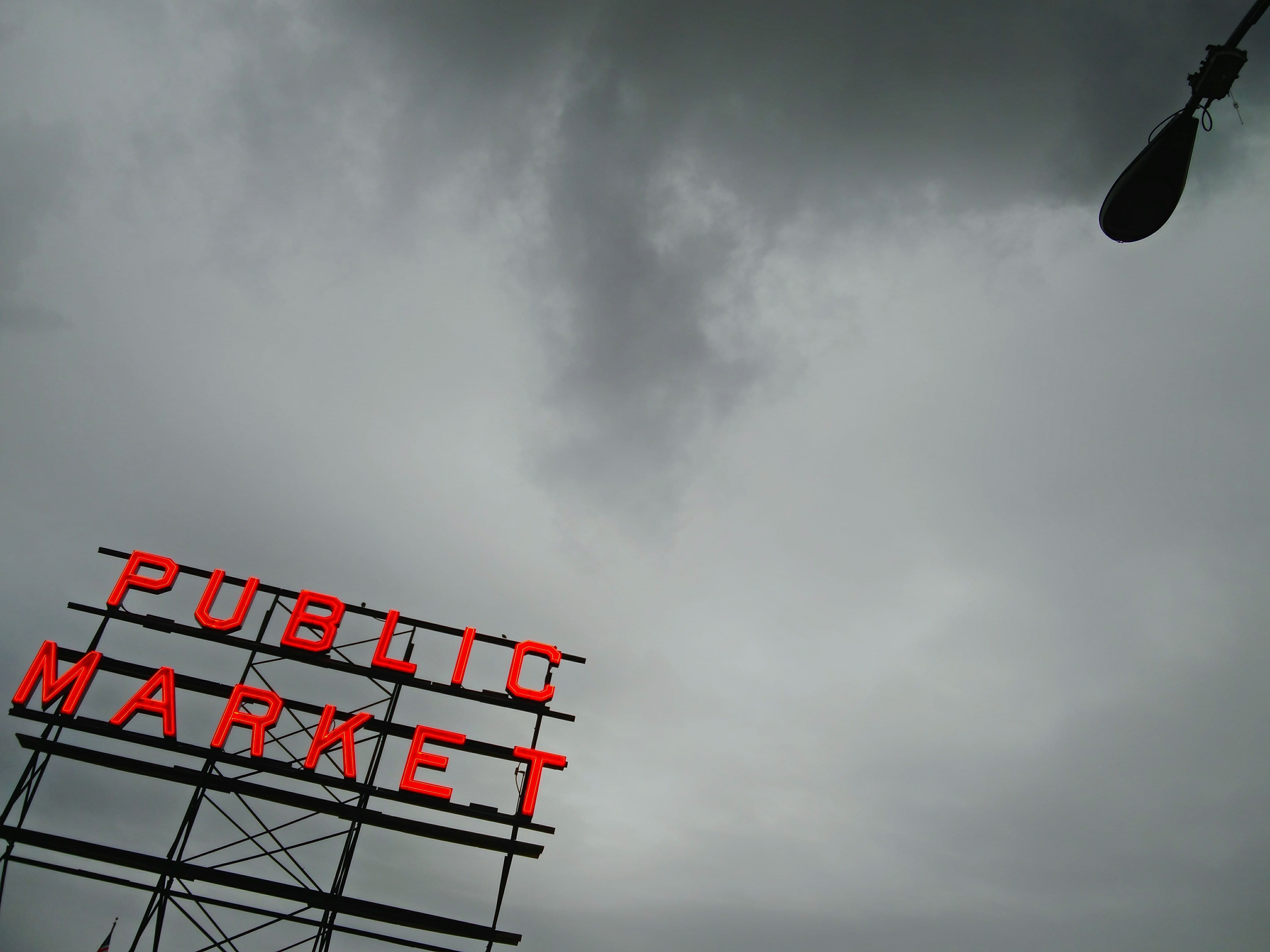 low angle view, western script, 4K, cloud - sky, city, rainy, flag, gray, day, flying, leisure activity, downtown, built structure, seattle, pike place, HD Wallpaper