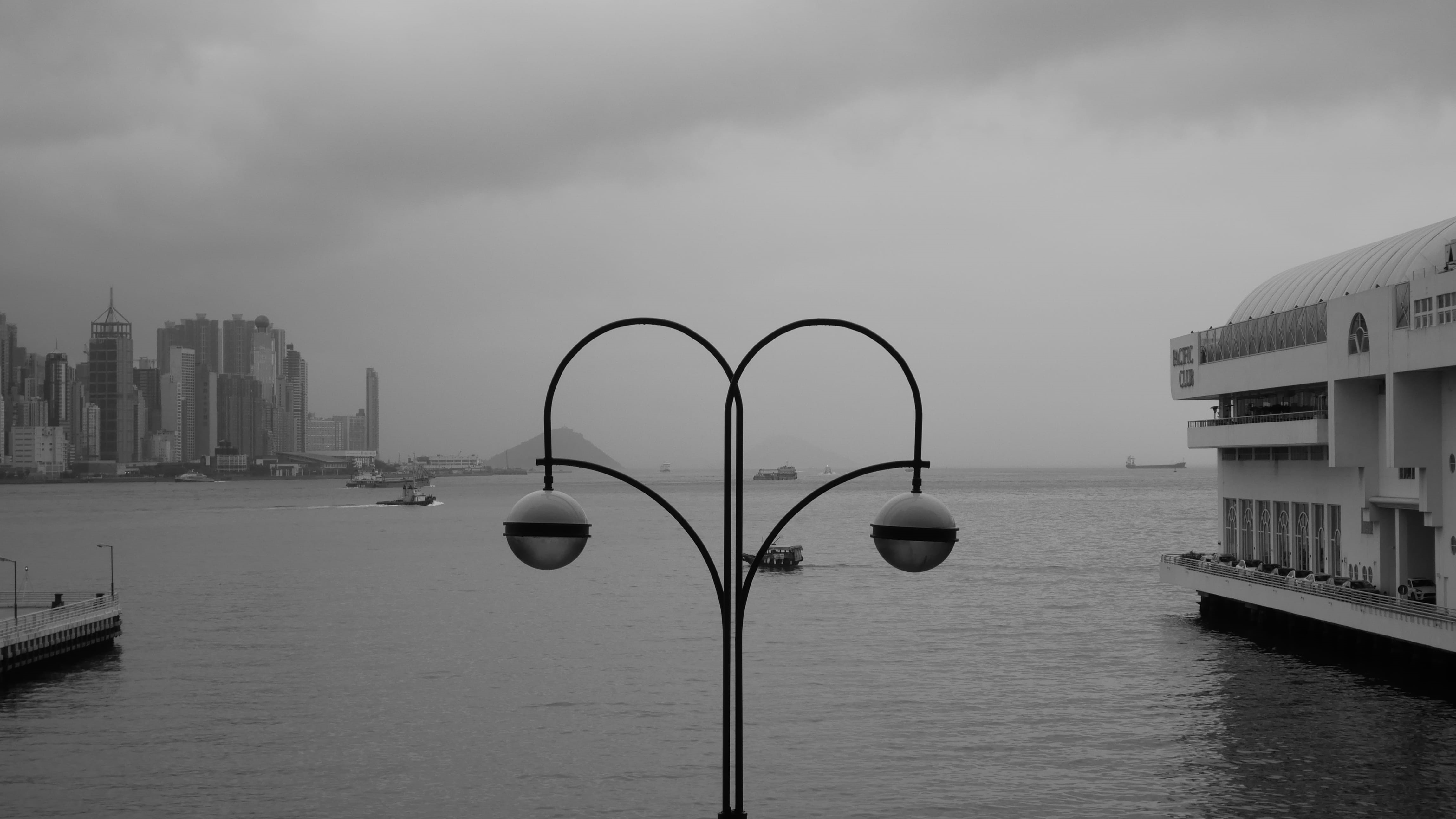 pier, office building exterior, boat, grayscale, weather, exappiah, transportation, day, vehicle, cloud - sky, ocean, hong kong, harbour city, no people, HD Wallpaper