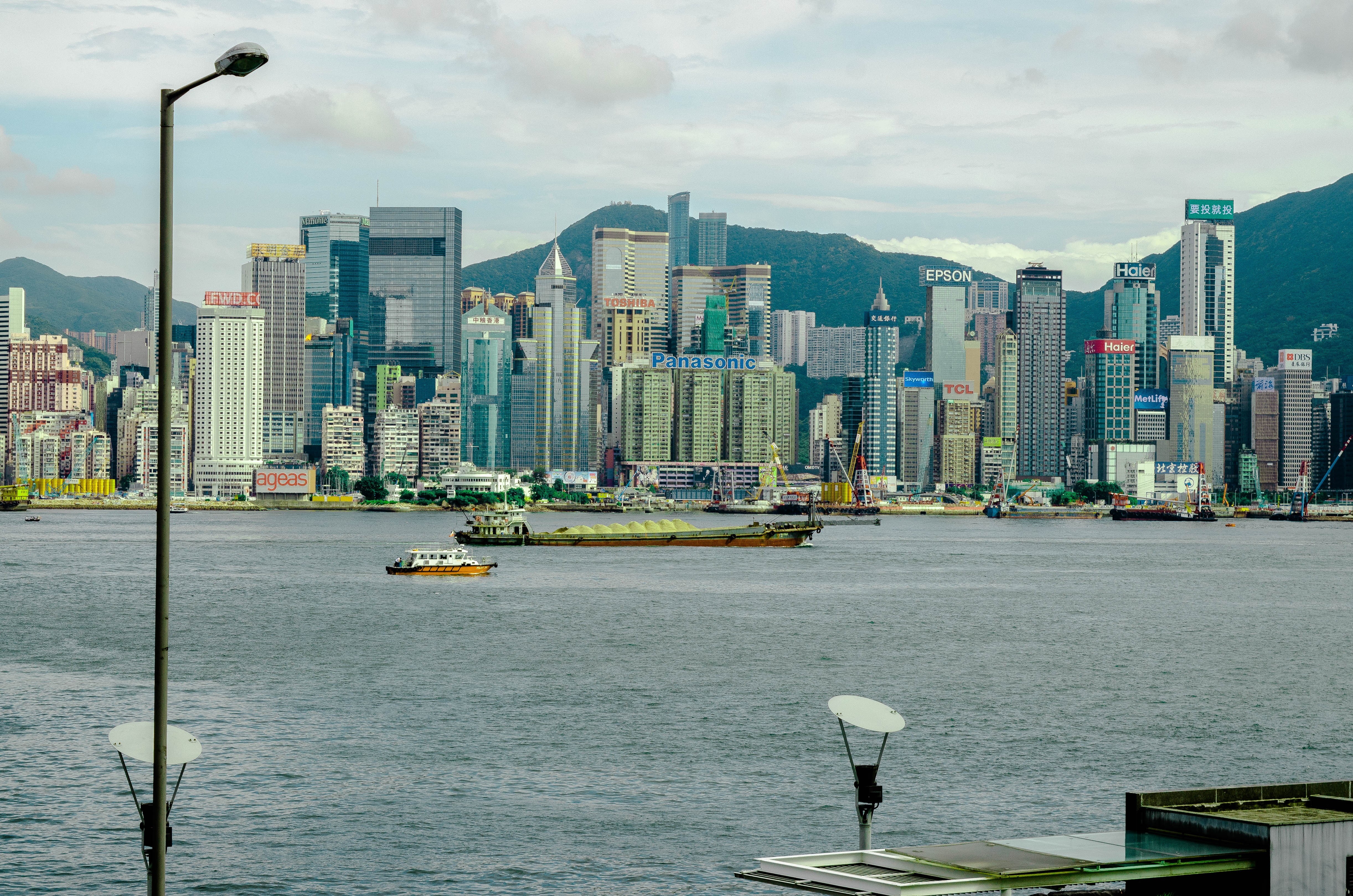 cityscape, water, 4K, sea, tall - high, modern, built structure, blue, skyscraper, cloud - sky, architecture, no people, financial district, Hong Kong, HD Wallpaper