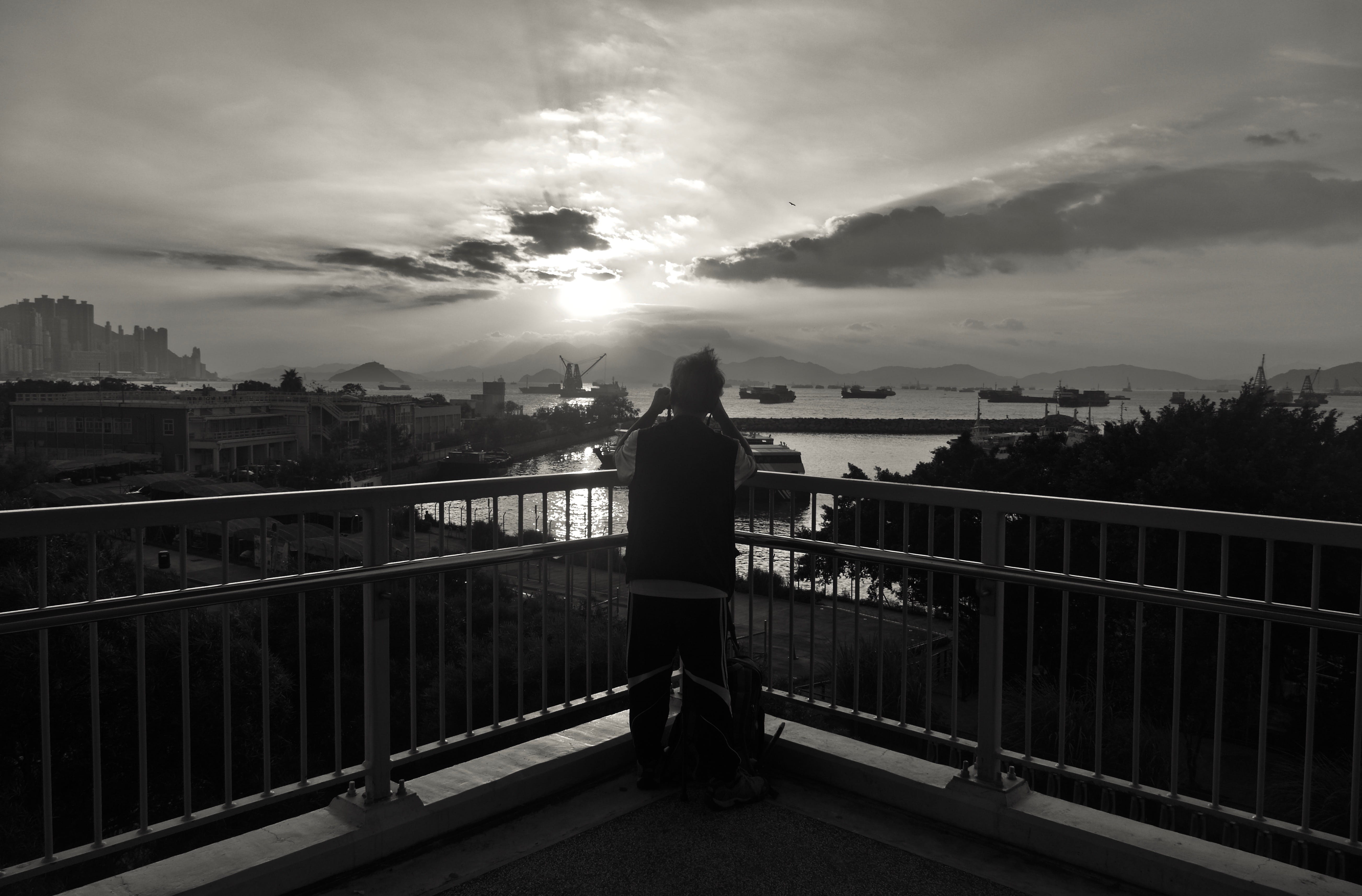 sky, lifestyles, warm clothing, people, men, sea, rear view, landscape, hong kong, full length, b/w, building, connection, cityscape, west kowloon cultural district, HD Wallpaper