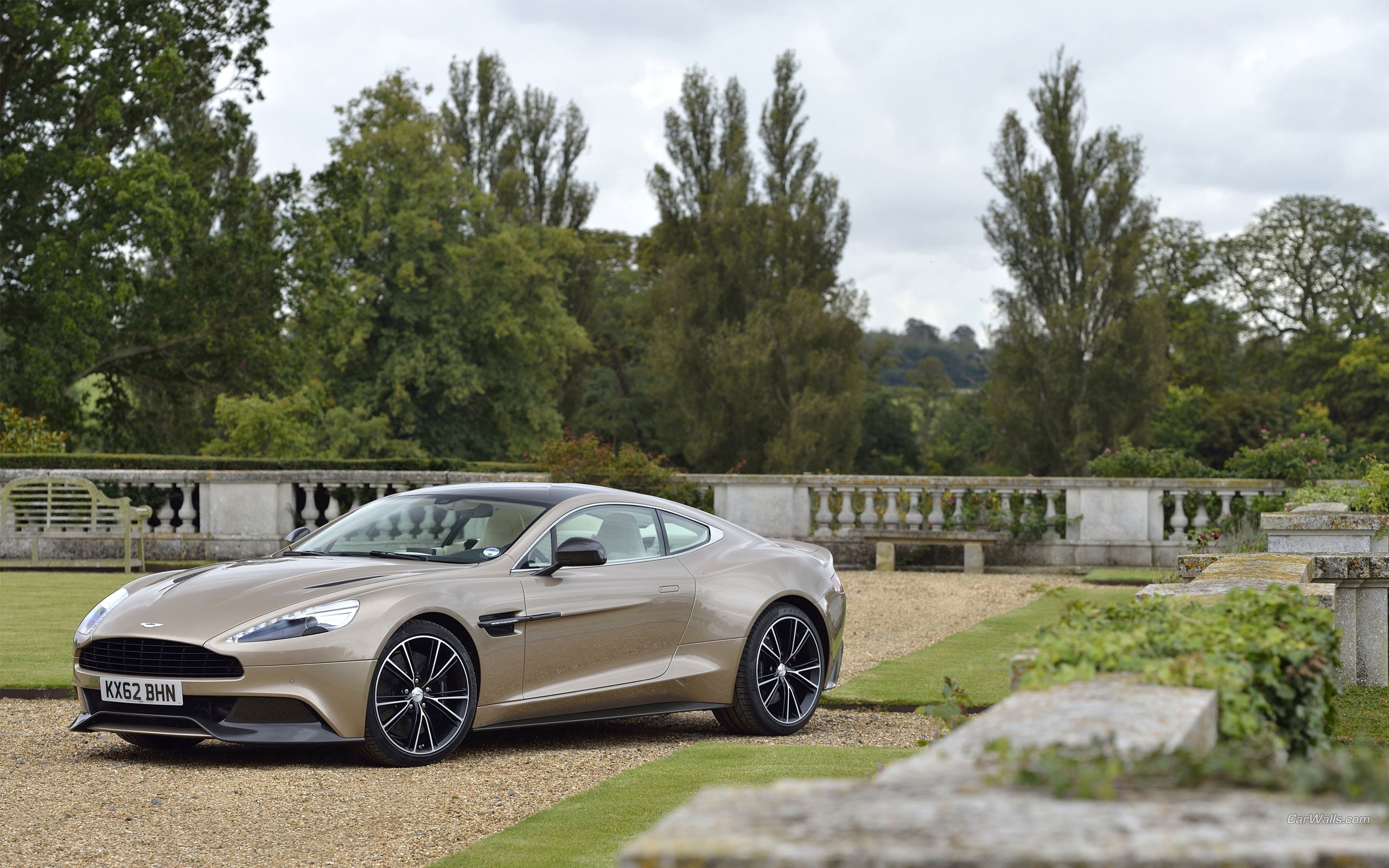 land vehicle, architecture, coupe, vehicle, Aston Martin Vanquish, plant, cloud - sky, day, car, built structure, sky, road, Aston Martin, luxury, outdoors, HD Wallpaper