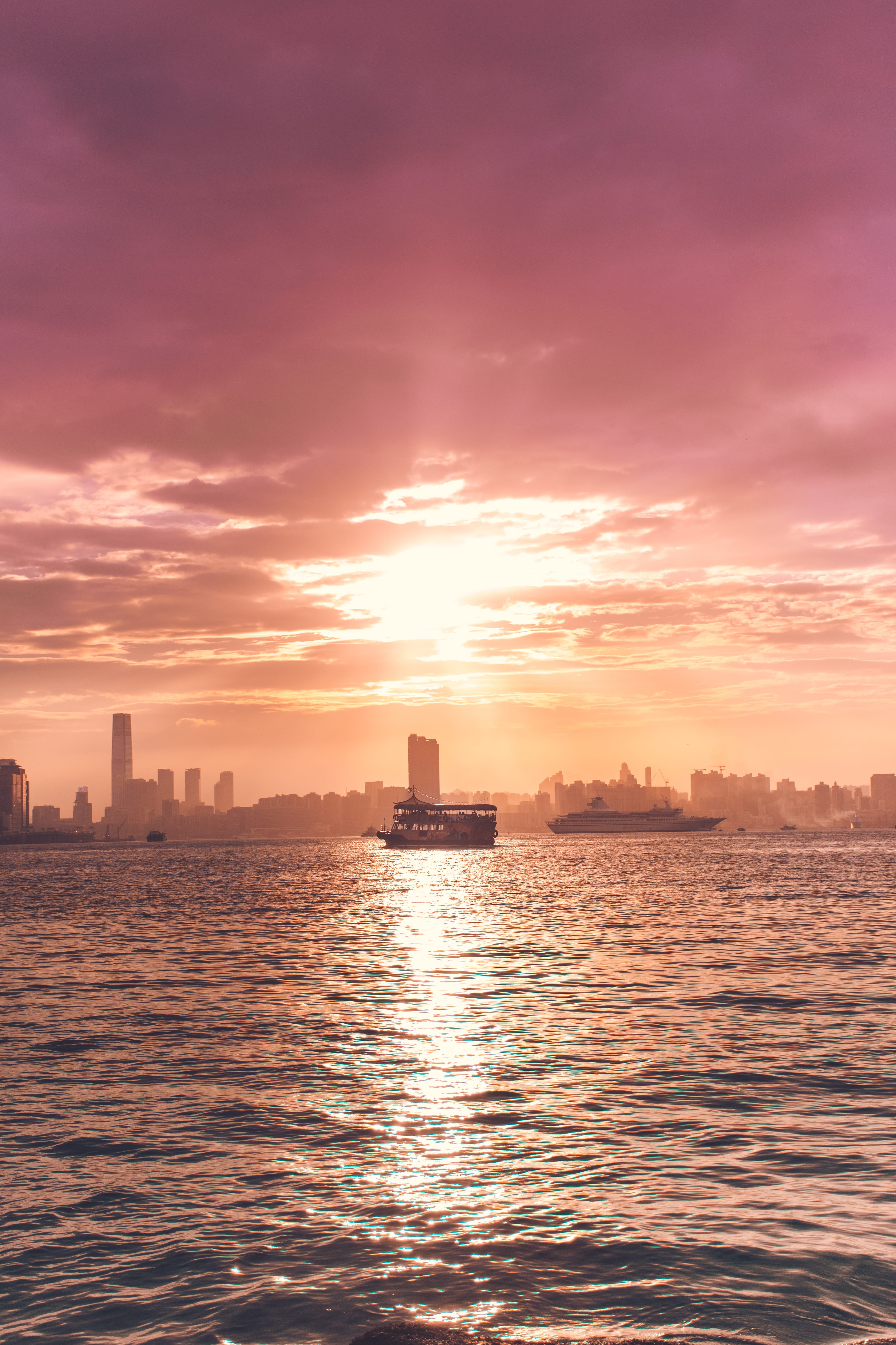 beauty in nature, 5K, sun, sunlight, outdoors, city, waterfront, built structure, architecture, hk, cloud - sky, harbour, middle, building, nature, no people, Phone HD Wallpaper