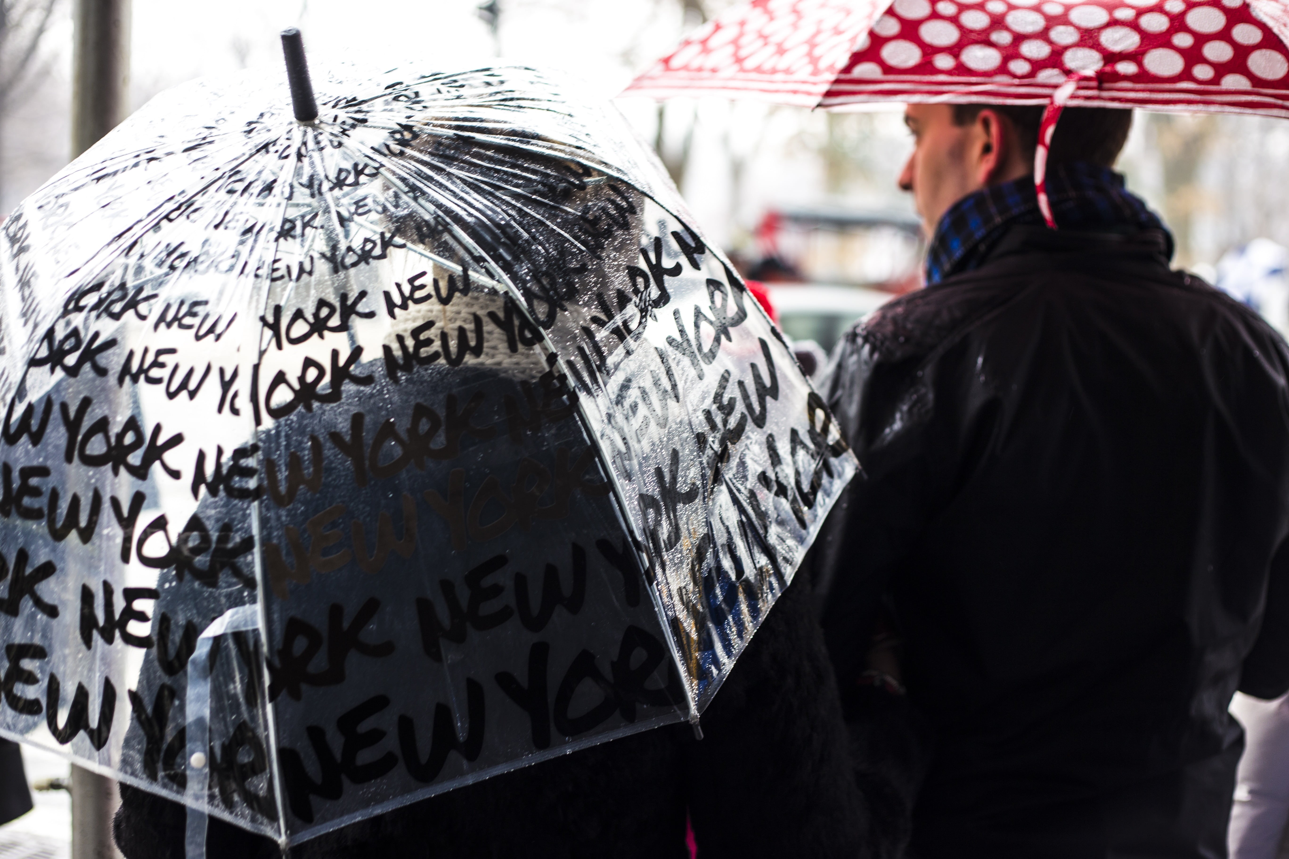 communication, daytime, wearing, 5K, rear view, city, clear, waist up, rain, text, focus on foreground, security, jacket, red, real people, man, near, HD Wallpaper