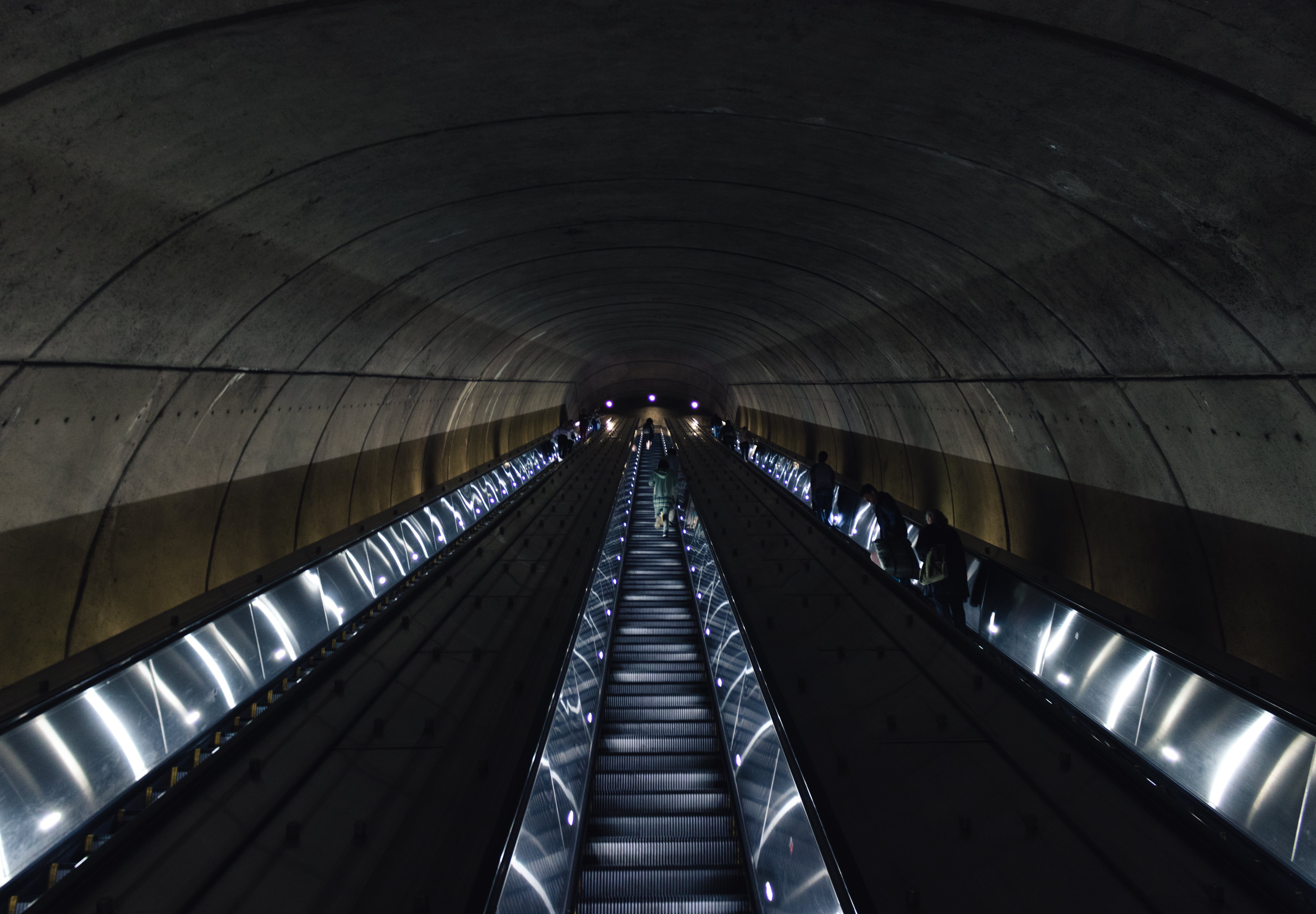 staircase, real people, diminishing perspective, metro, arch, railing, illuminated, low angle view, technology, direction, 5K, architecture, ceiling, one person, HD Wallpaper