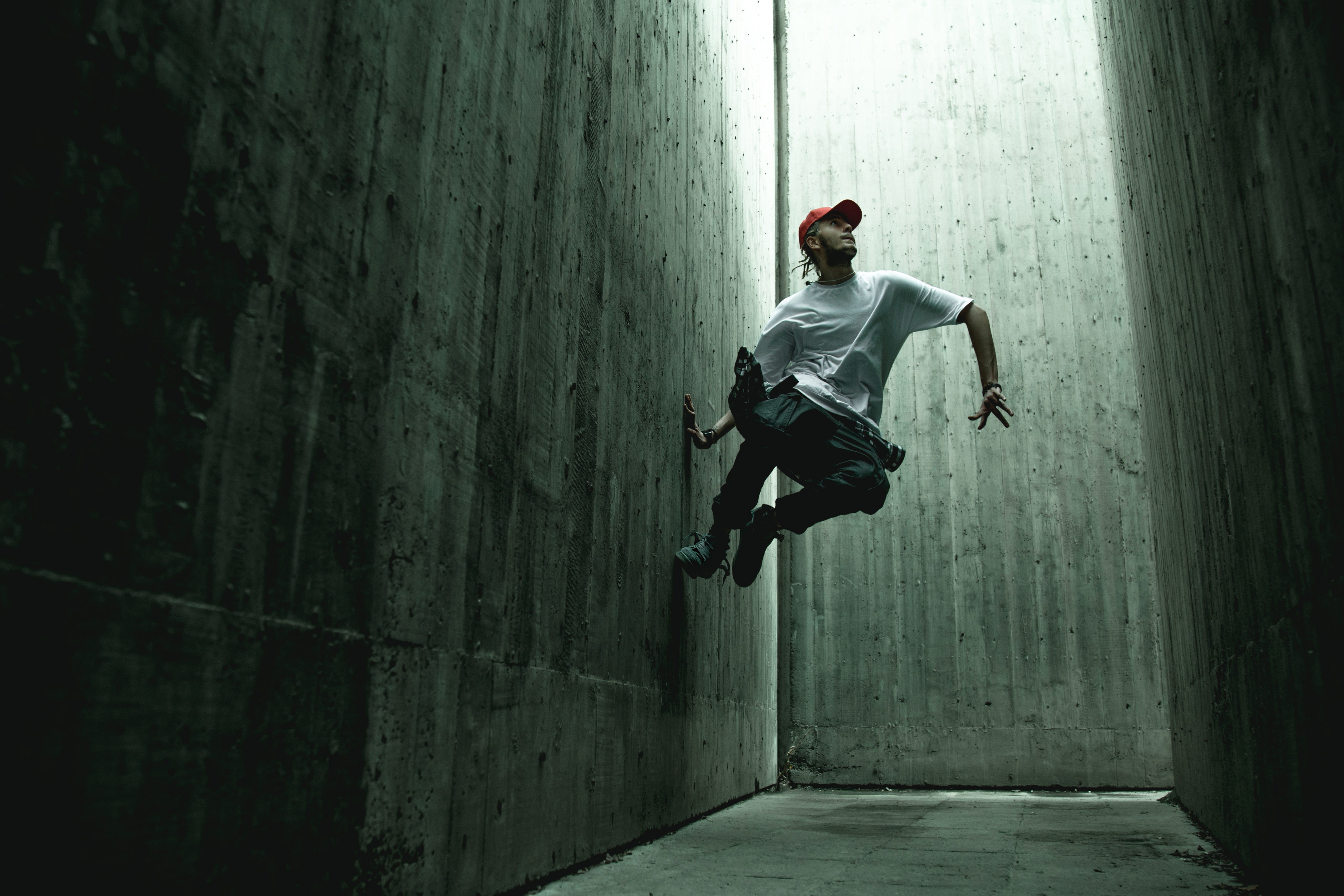 one person, shoe, shirt, leisure activity, footwear, white, leisure activities, human, concrete, mid-air, wall, architecture, outdoors, apparel, tunnel, HD Wallpaper