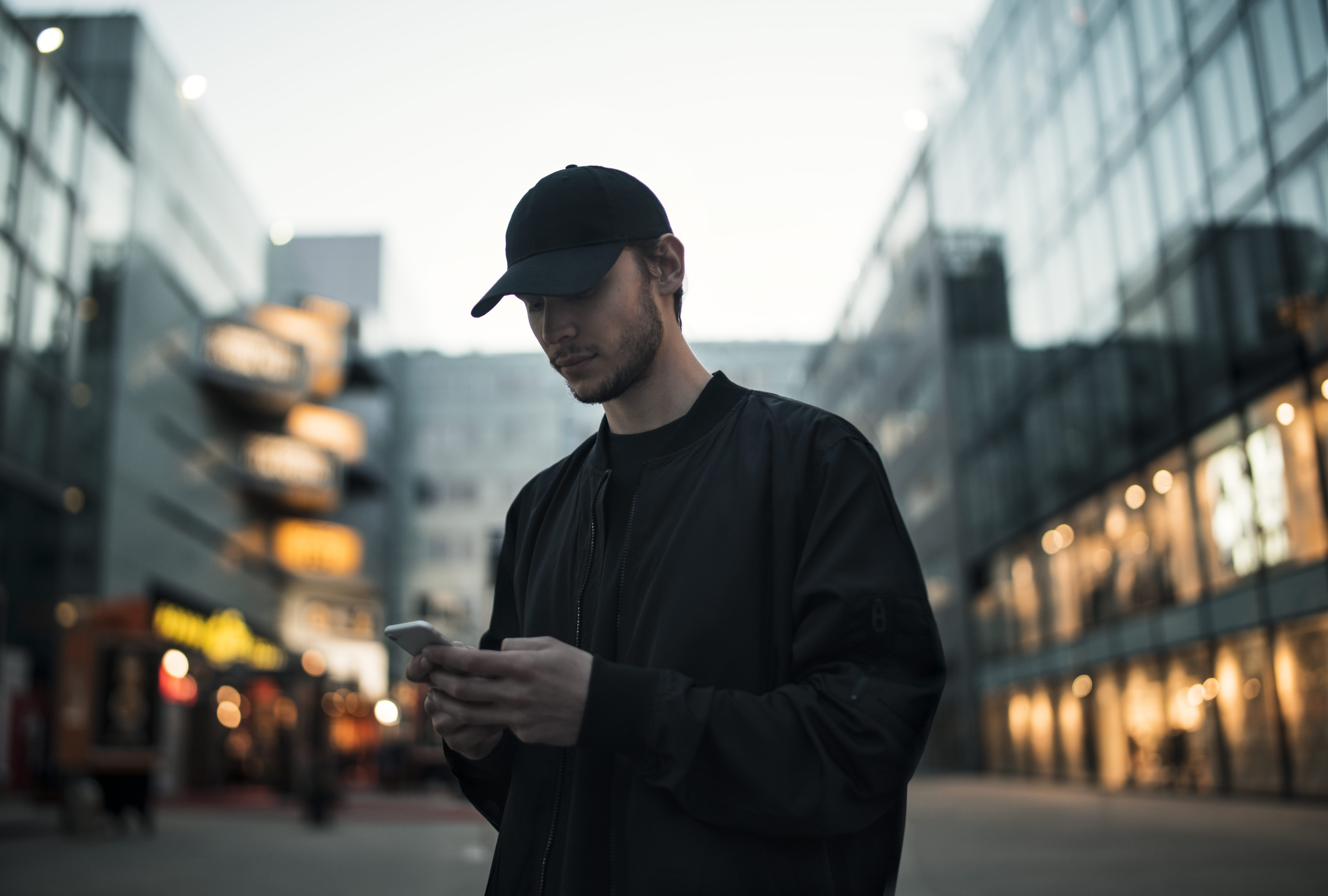 holding, using, one person, technology, phone, baseball cap, fashion, electronics, outdoors, cap, communication, clothing, building exterior, standing, HD Wallpaper