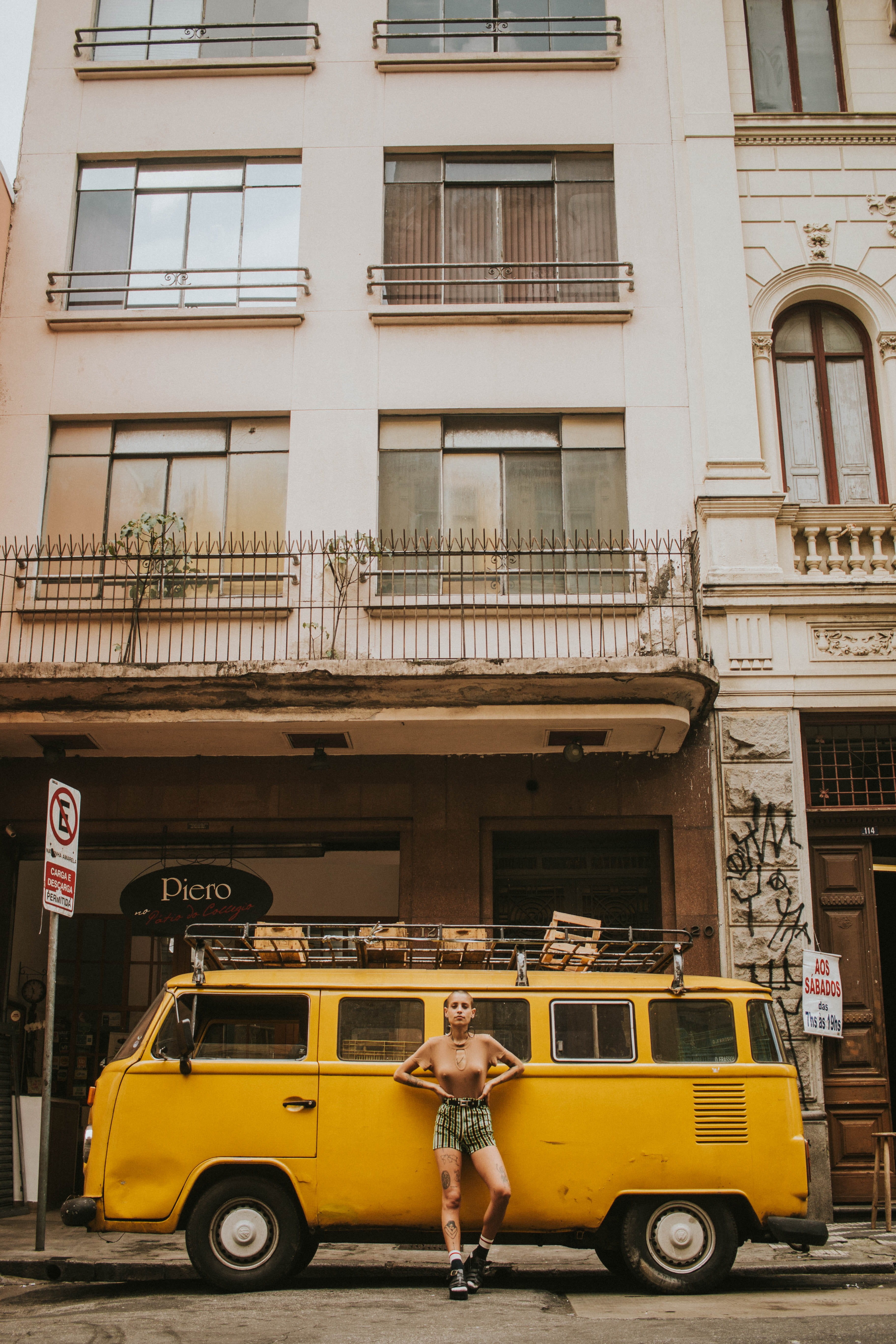 building, city life, yellow, building exterior, young adult, outdoors, day, vehicle, street, daytime, town, motor vehicle, car, leaning, architecture, city, Phone HD Wallpaper