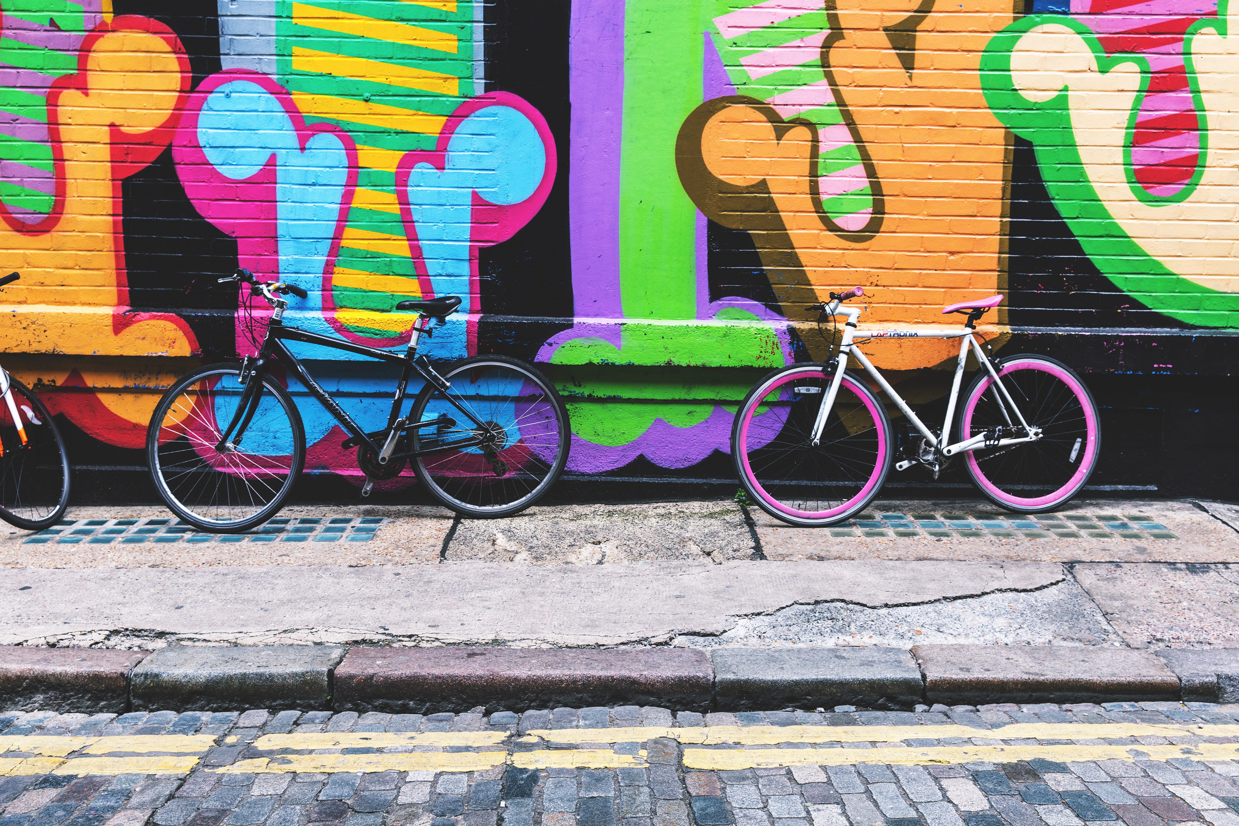 stand, art, art and craft, covered, wall - building feature, Bicycles, creativity, neon, no people, day, multi Colored, bicycle, sidewalk, outdoors, street Art, HD Wallpaper