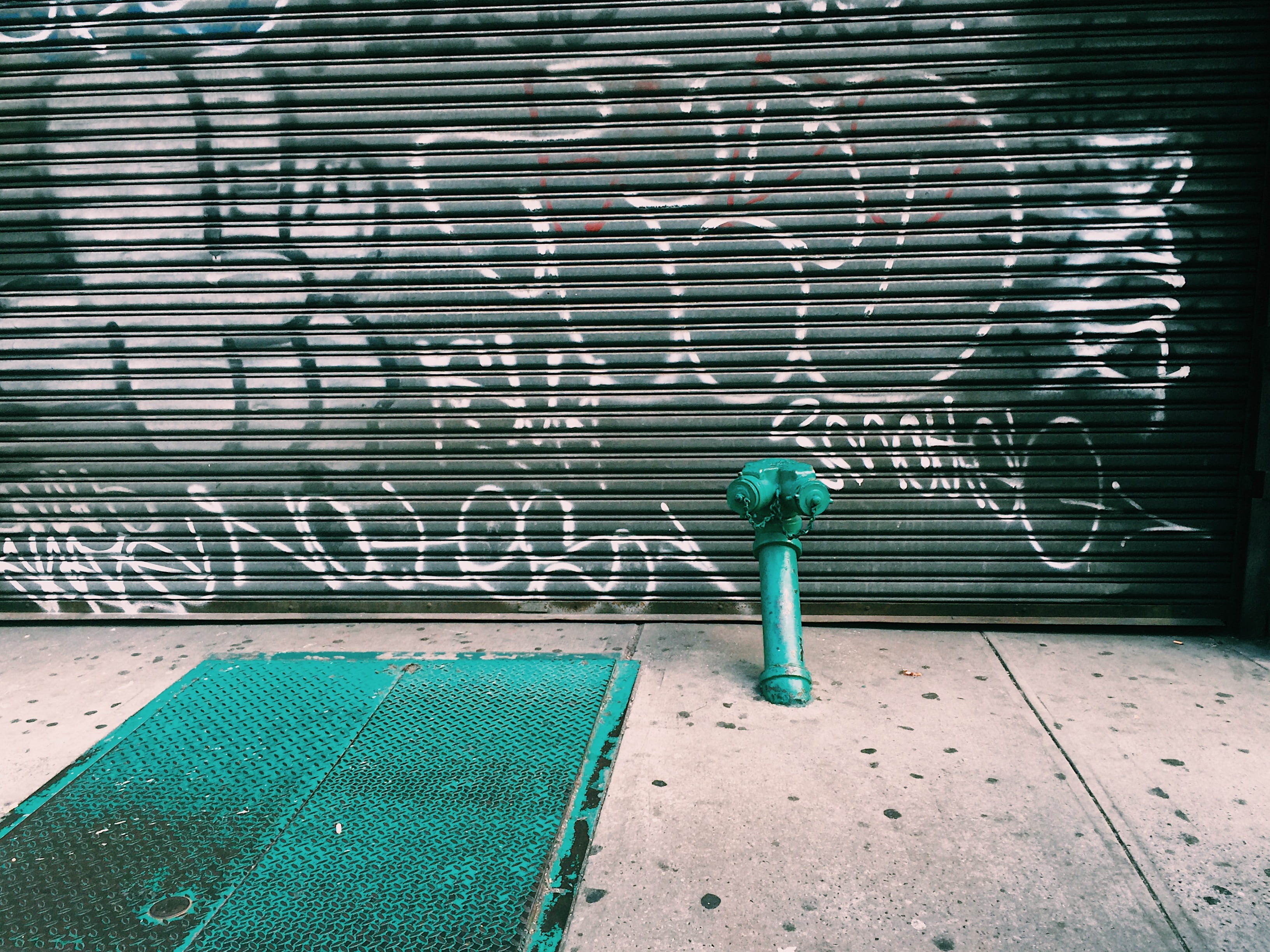 one person, garage, outdoors, graffiti, nature, hydrant, footpath, door, wall, near, casual clothing, urban, metal, architecture, 2K, standing, green color, HD Wallpaper