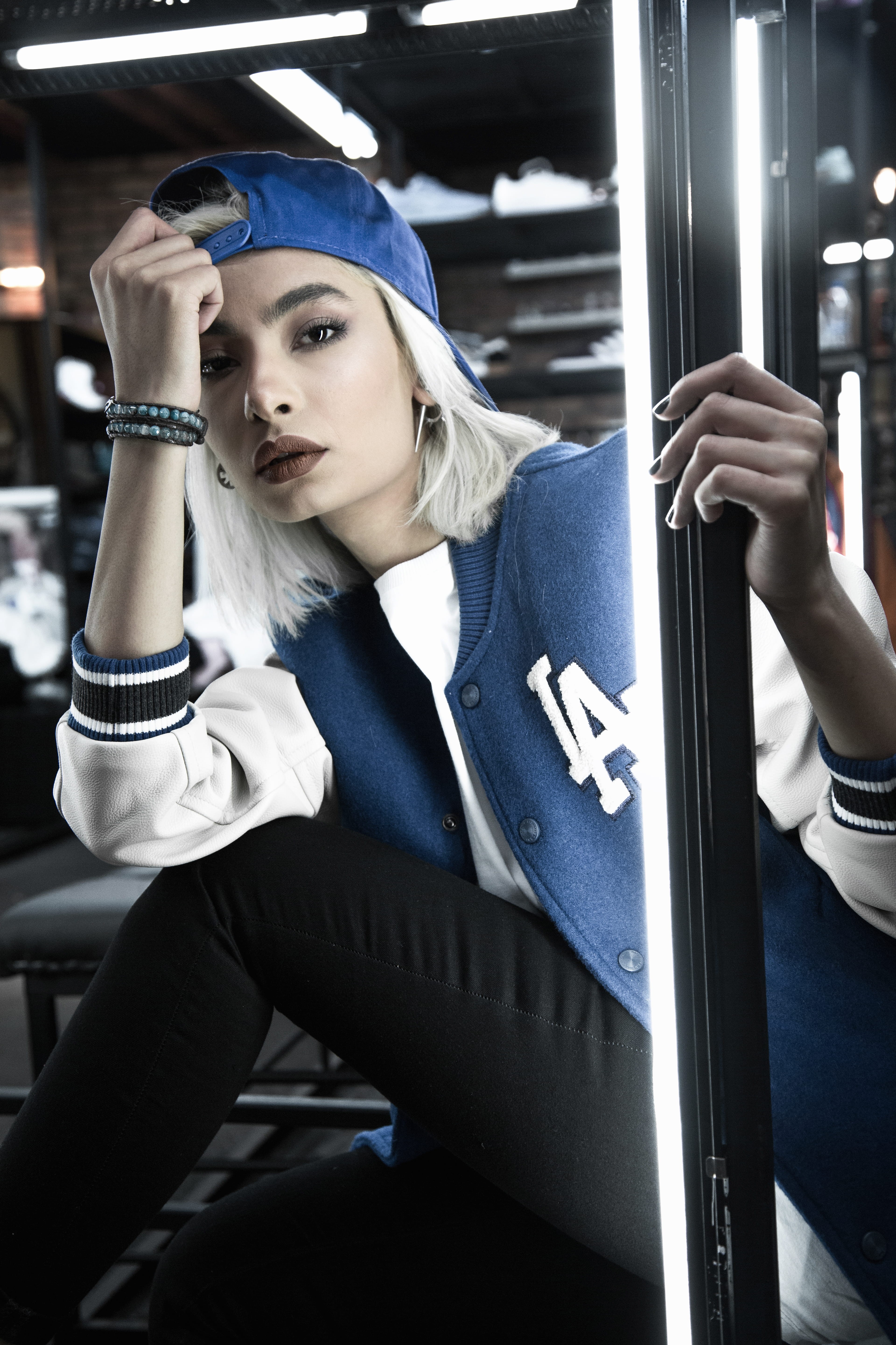 sitting, person, banister, shallow, suit, goggles, mode of transportation, letterman, cap, footwear, hat, white, clothing, rail transportation, lifestyles, Phone HD Wallpaper