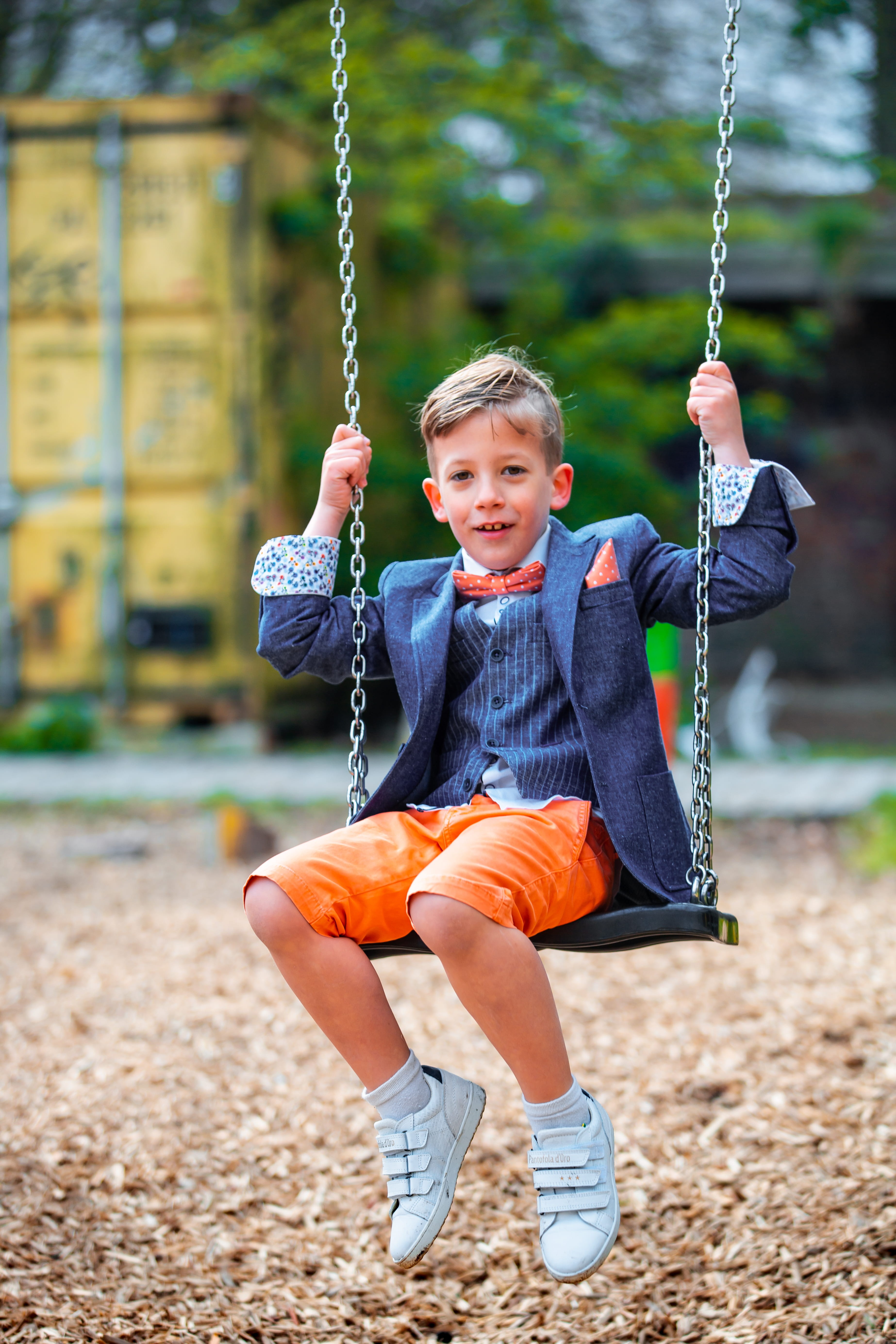 human, fun, boys, one person, coat, clothing, males, full length, sitting, denim, childhood, overcoat, apparel, suit, jeans, outdoors, shoe, playground, Phone HD Wallpaper