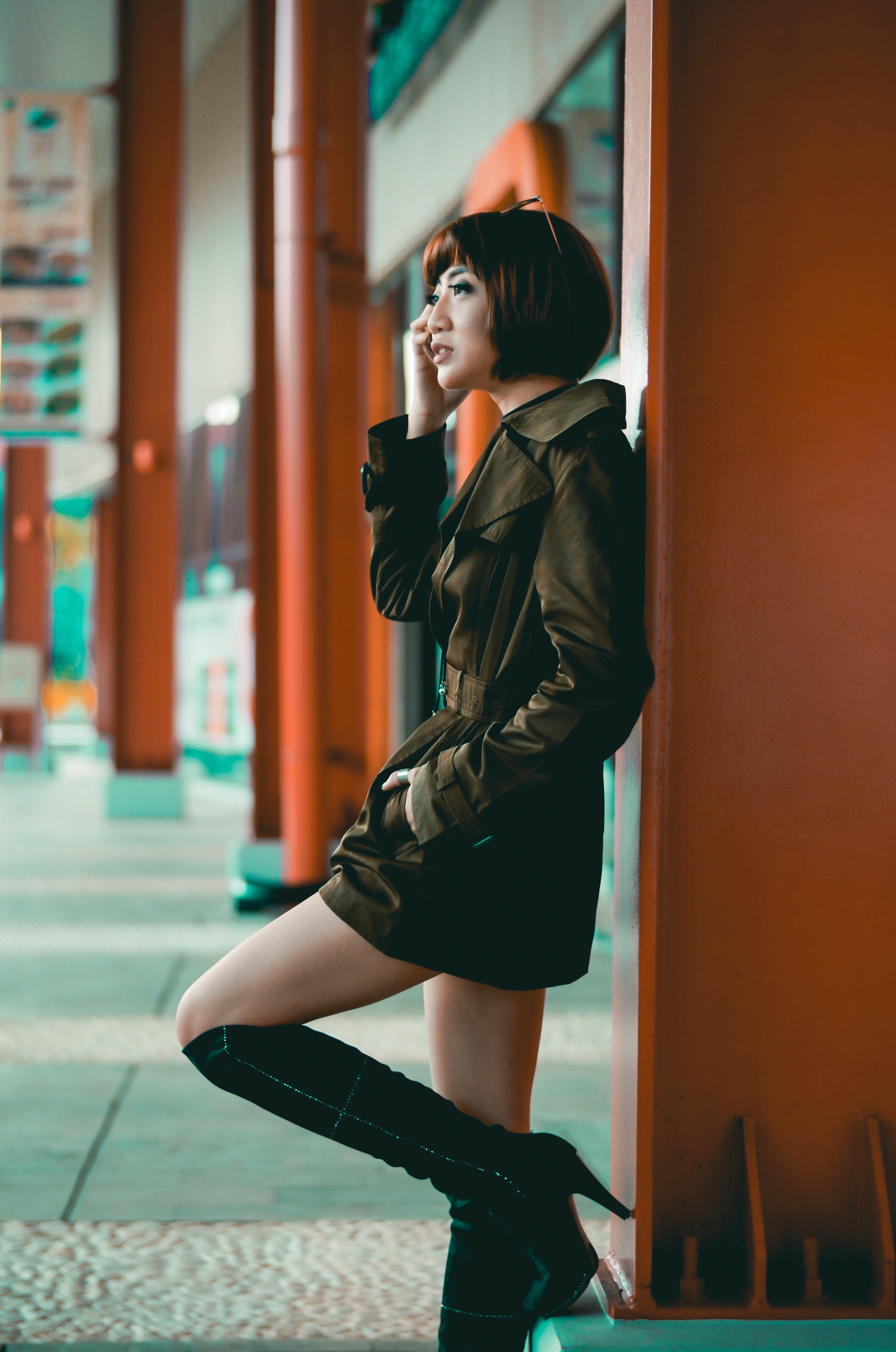 looking away, 4K, beautiful woman, flooring, clothing, human, focus, standing, boot, leaning, young adult, casual clothing, brown, corridor, three quarter length, Phone HD Wallpaper