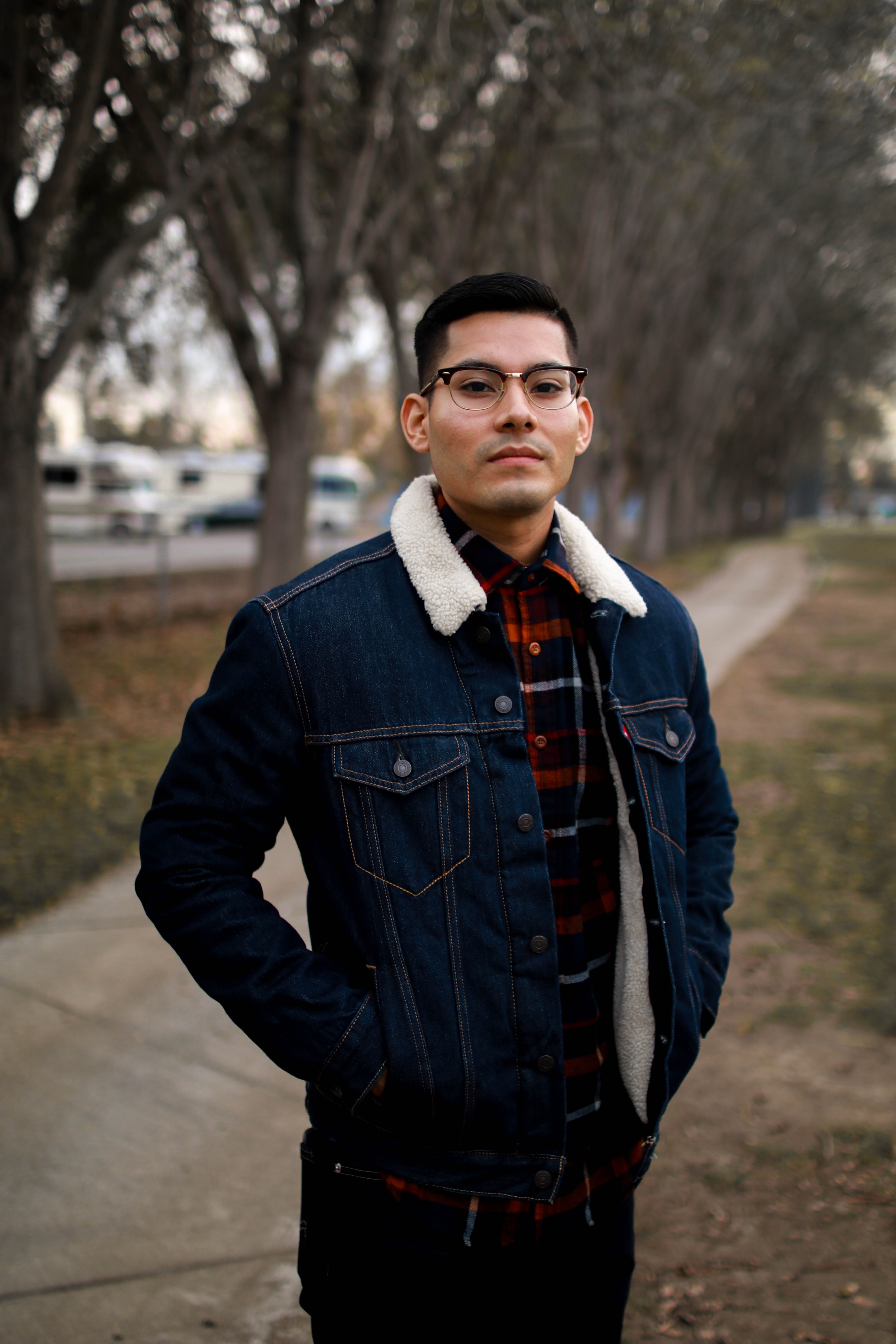 outdoors, trees, overcoat, young adult, accessory, near, apparel, man, young men, shelf, fountain valley, selective, denim, focus, day, tree, jeans, sleeve, Phone HD Wallpaper