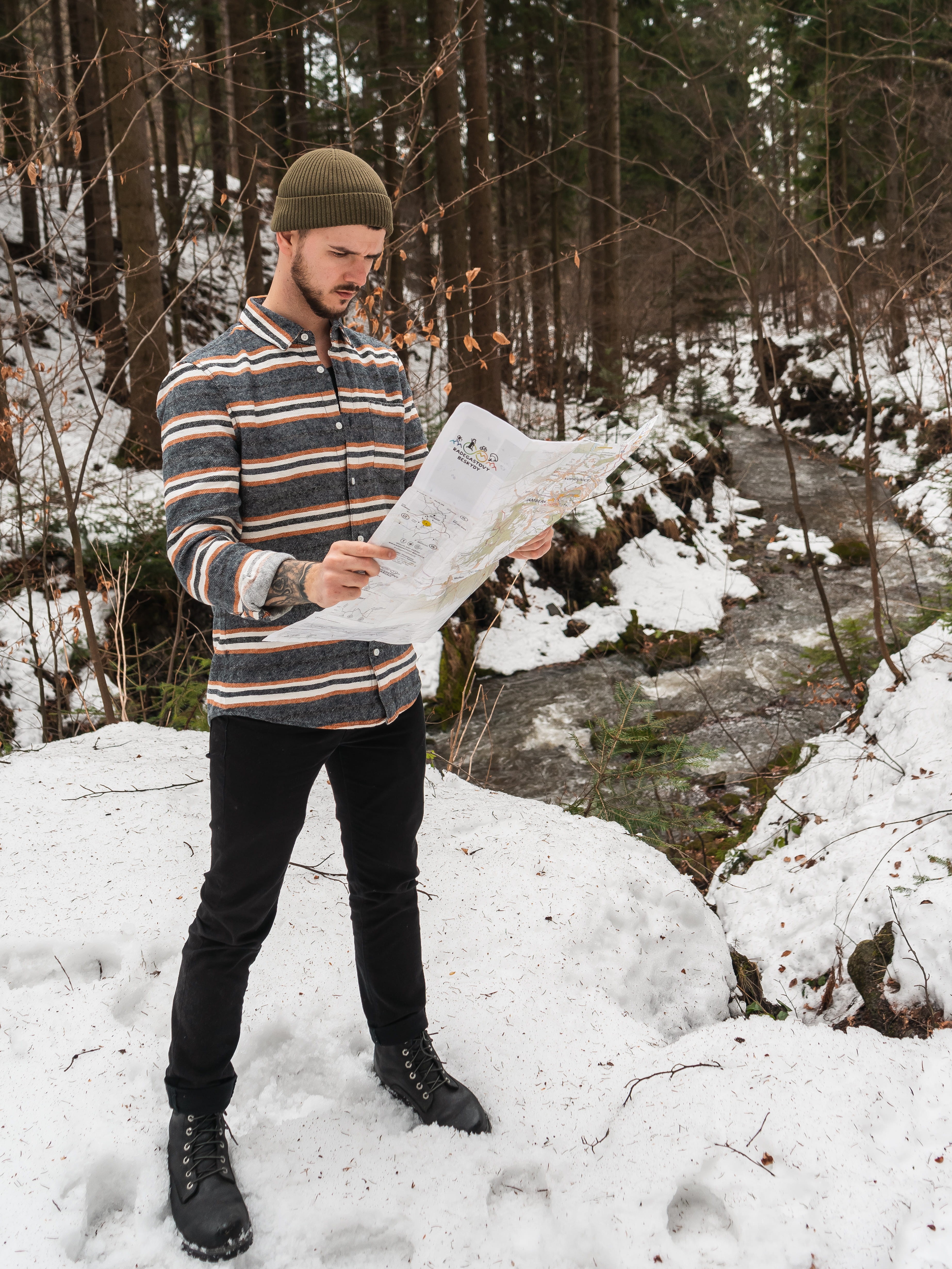 apparel, teenager, map, man, winter, nature, holding, lost, tree, warm clothing, cold temperature, day, white, person, cap, ice, one person, hat, young men, Phone HD Wallpaper