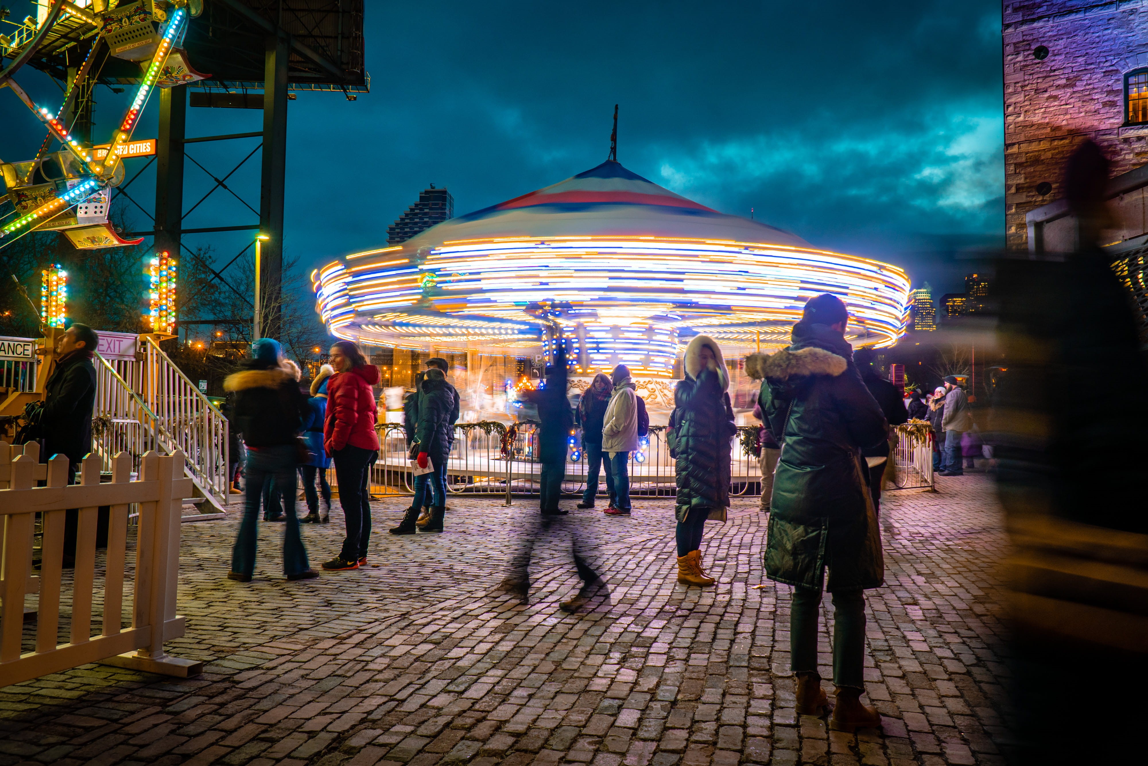 human, real people, tent, amusement park ride, city, amusement park, footwear, festival, architecture, shoe, long exposure, person, coat, leisure activity, HD Wallpaper