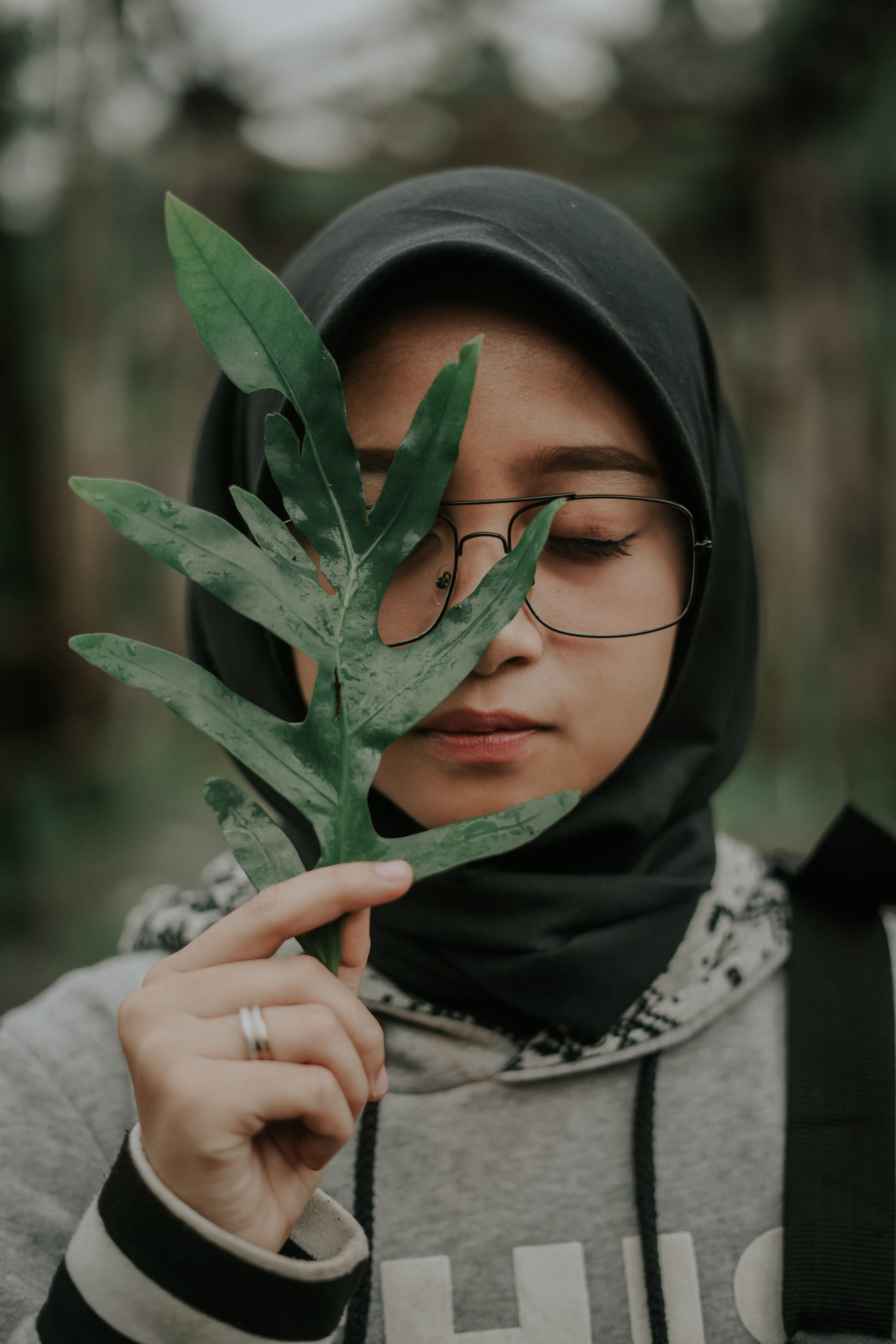 leaf, hand, lifestyles, outdoors, head, hood, headshot, food, close-up, leisure activity, young adult, vegetable, cricket insect, human hand, finger, one person, Phone HD Wallpaper