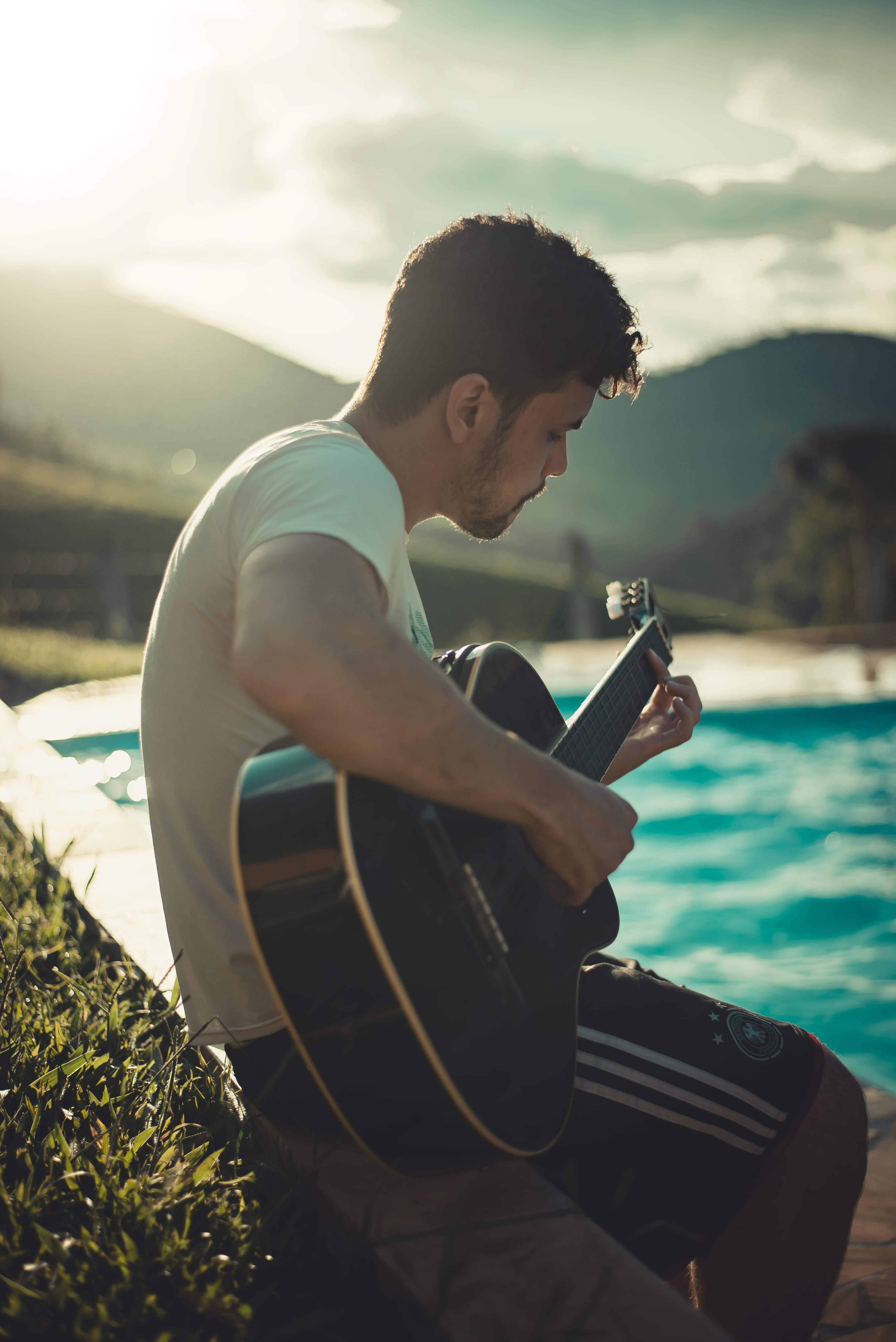 blur, outdoors, guitar, stringed instrument, water, nature, recreation, 5K, young men, wear, model, side view, casual clothing, lifestyles, real people, Phone HD Wallpaper