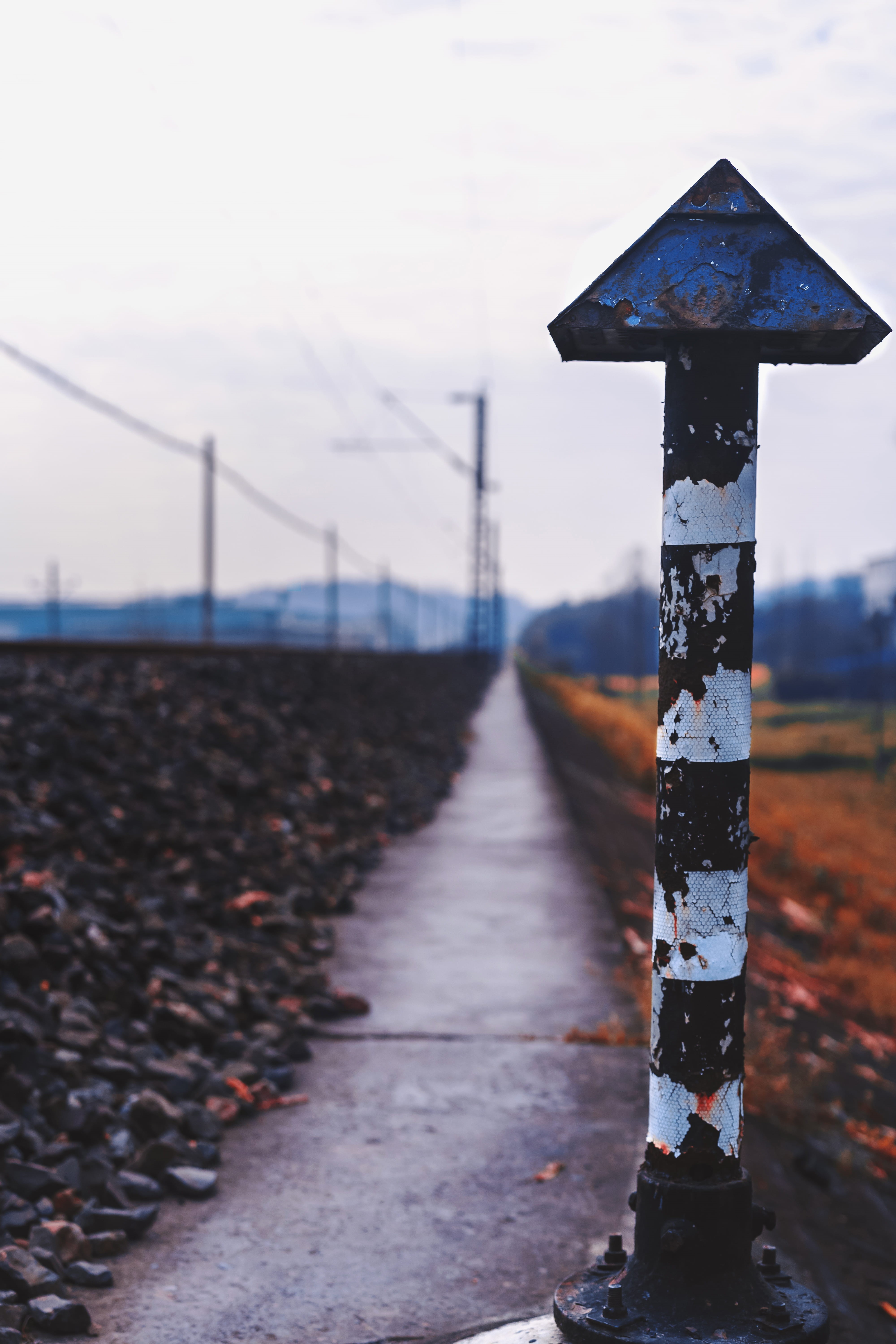 day, communication, symbol, connection, rail, focus on foreground, boundary, train, barrier, bolster, gravel, nature, safety, security, direction, no people, Phone HD Wallpaper