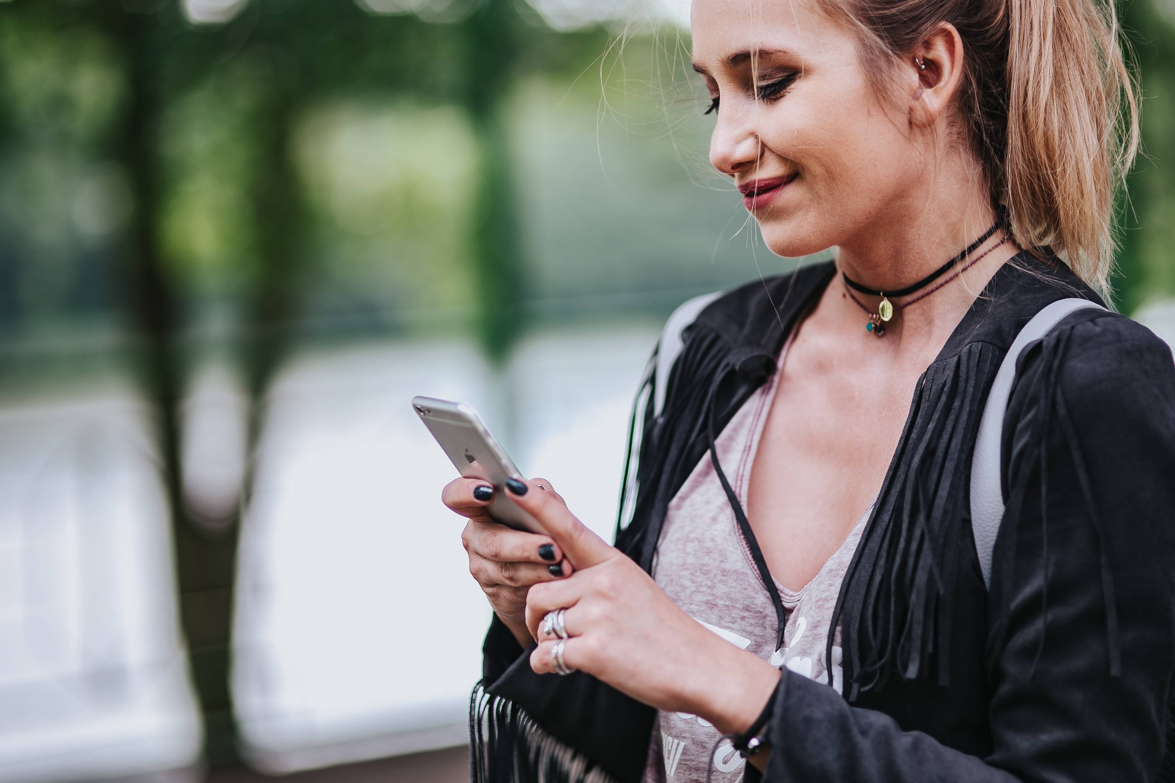 caucasian Ethnicity, rail, lifestyles, only women, day, Blonde, jacket, one Person, communication, adult, hair, 2K, one Woman Only, portable information device, HD Wallpaper