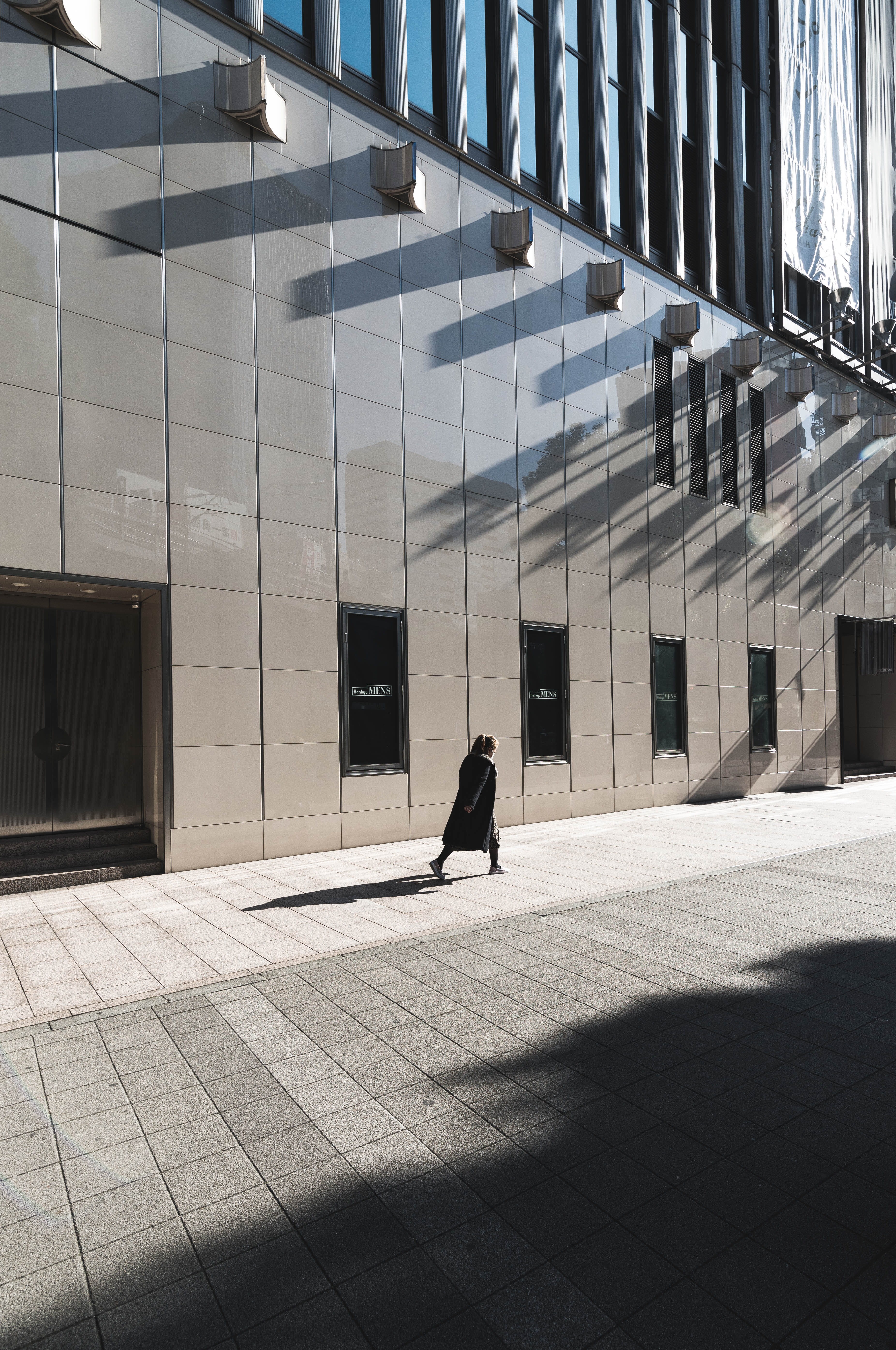 shadow, rear view, near, one person, person, pavement, built structure, long, rise, building, beside, black, building exterior, leisure activity, dress, Phone HD Wallpaper
