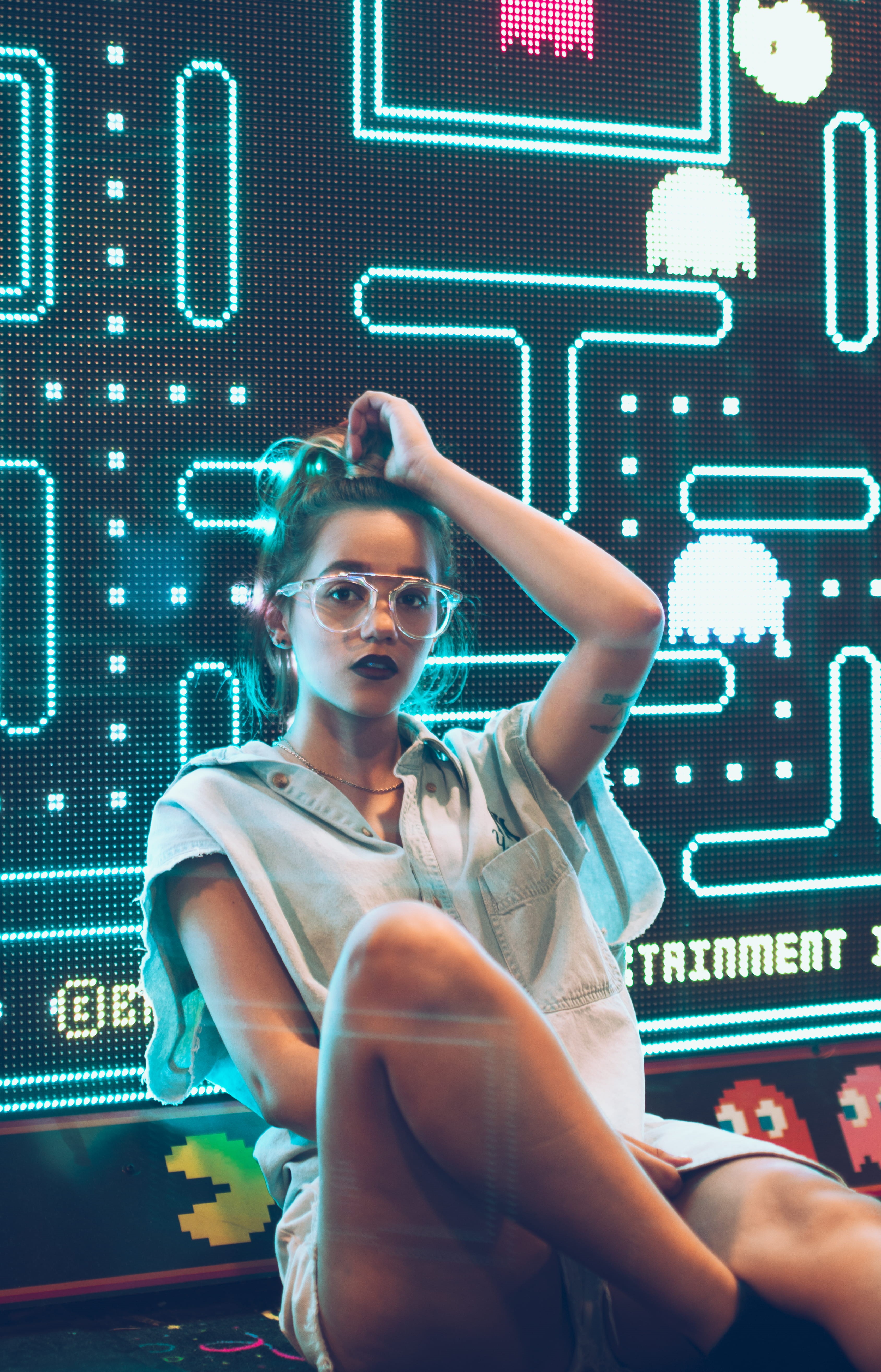 hairstyle, pacman, screen, front view, girl, adult, inside, room, displaying, portrait, sunglasses, 5K, monitor, machine, beautiful woman, looking at camera, Phone HD Wallpaper