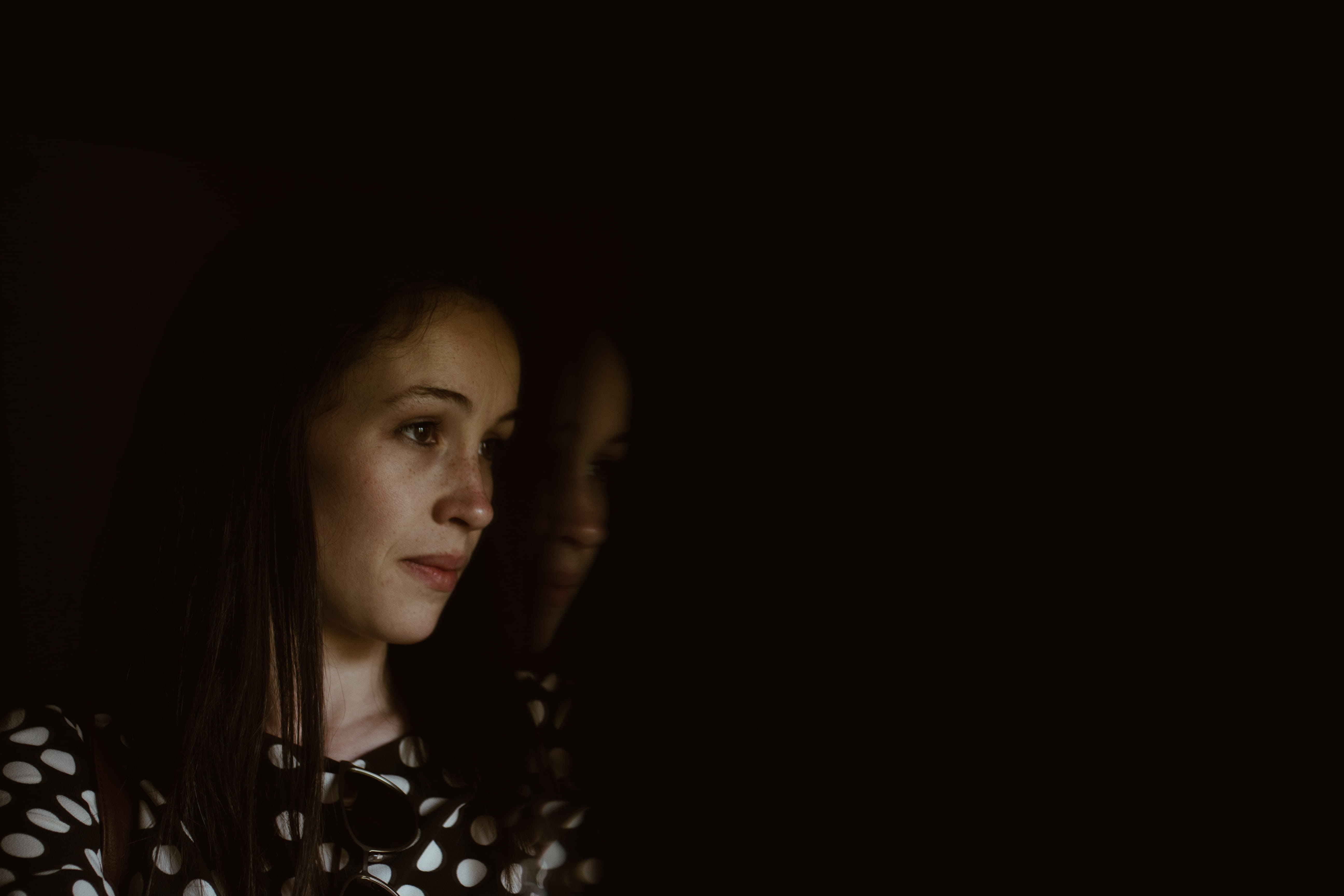 hairstyle, girl, shirt, person, sad, beautiful woman, 5K, darkness, fashion, dot, studio shot, black, copy space, looking, young, white, black background, HD Wallpaper