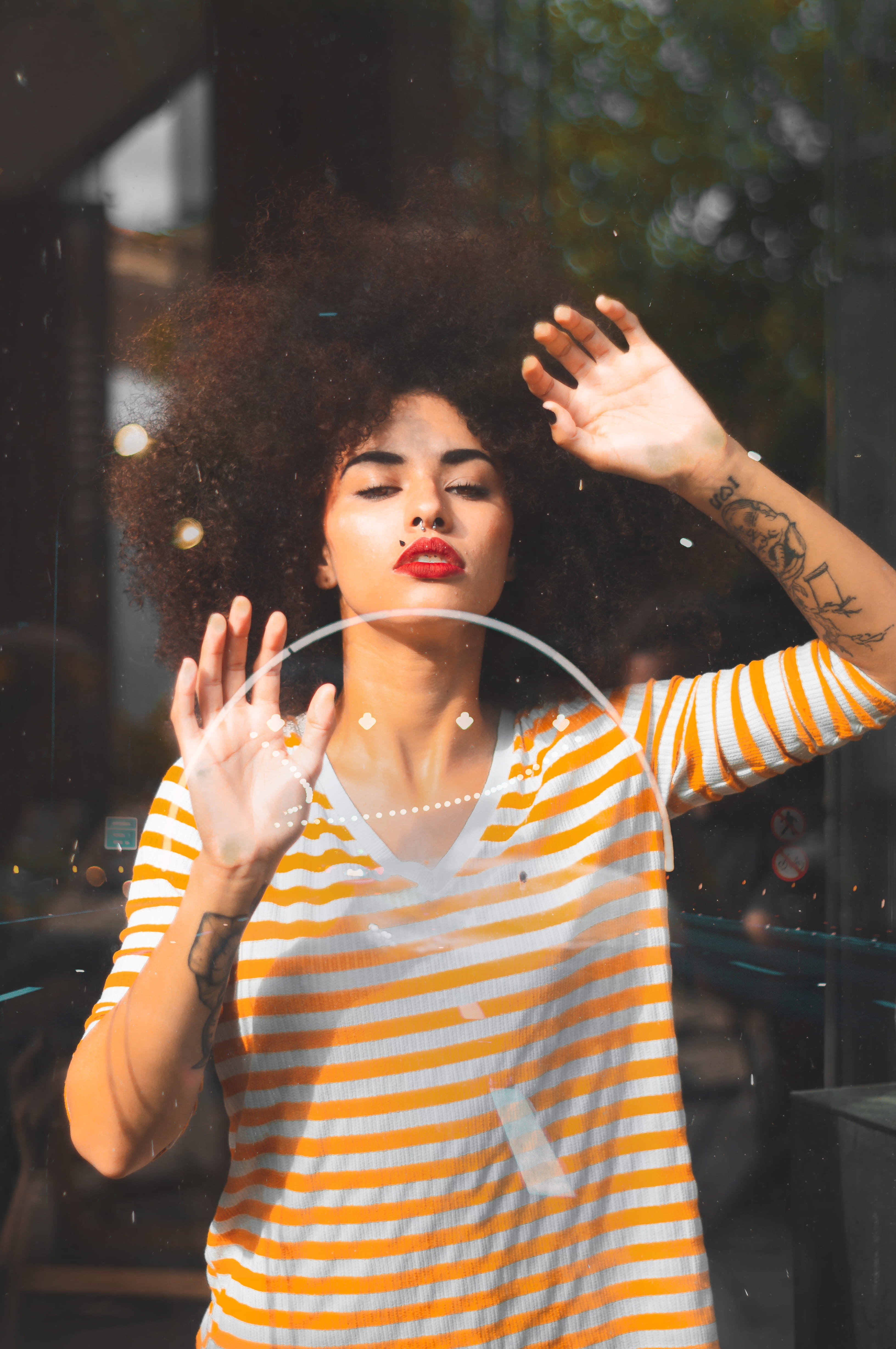 afro, beautiful woman, human arm, beauty, tattoo, arms raised, white, light, 4K, striped, music, wall, looking, adult, real people, leaning, hairstyle, Phone HD Wallpaper