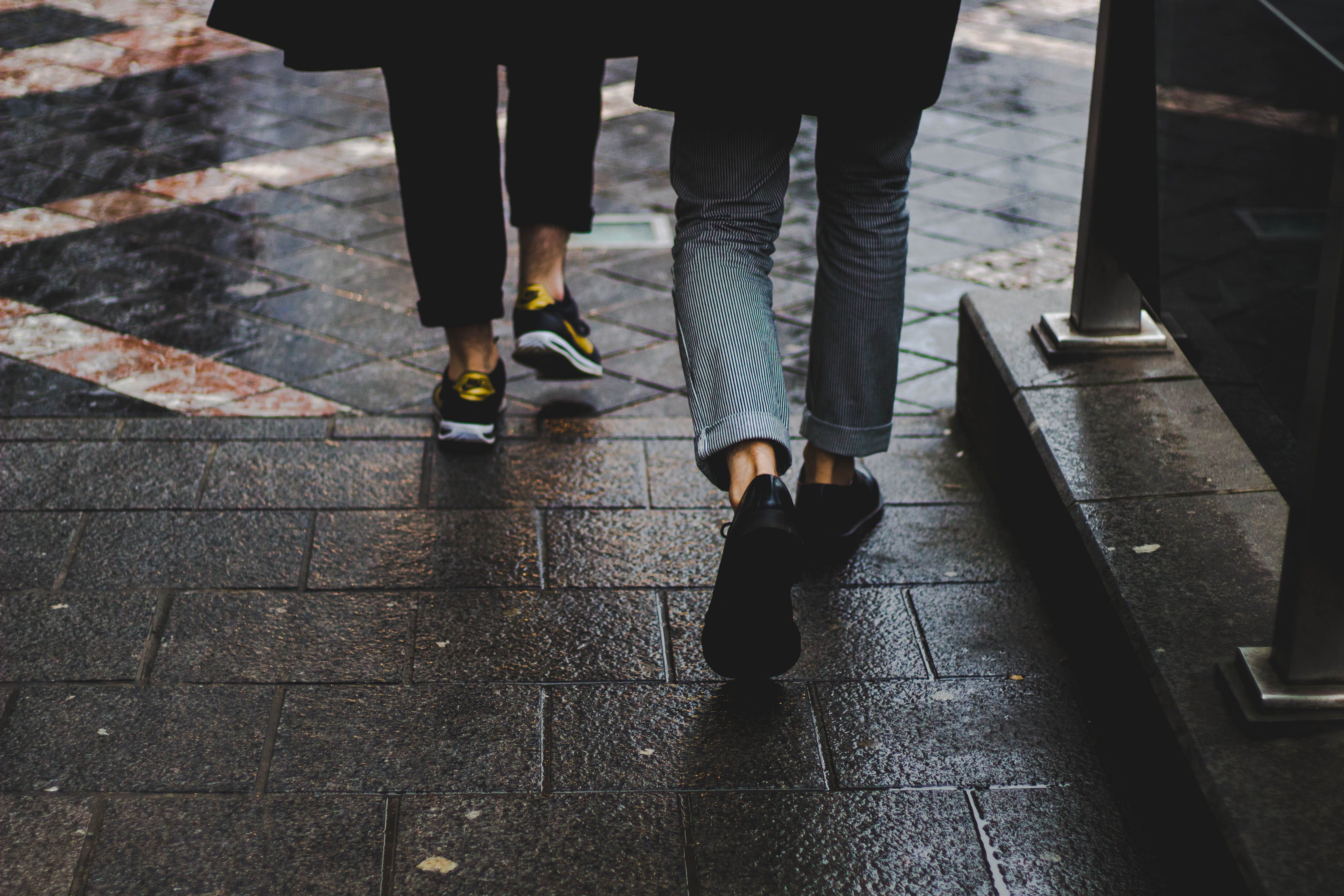 brick, pavement, lifestyles, two people, footpath, wearing, walking, real people, concrete, day, human body part, bench, wall, wet, 5K, two, men, near, HD Wallpaper