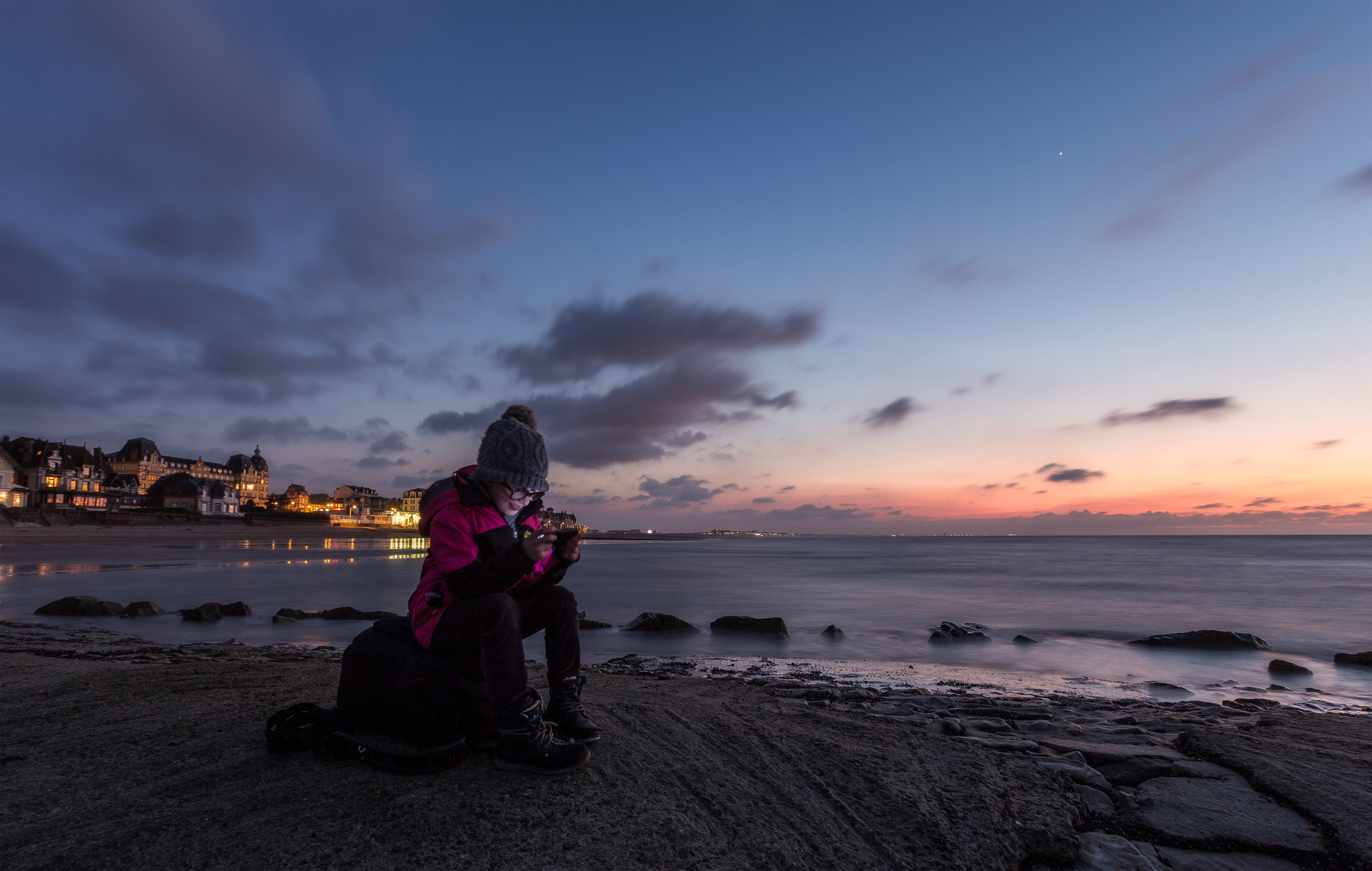 relaxation, social media, woman, youth, solid, scenics - nature, happy, beauty in nature, glasses, ocean, rest, mobile phone, media, blue, sunset, full length, HD Wallpaper