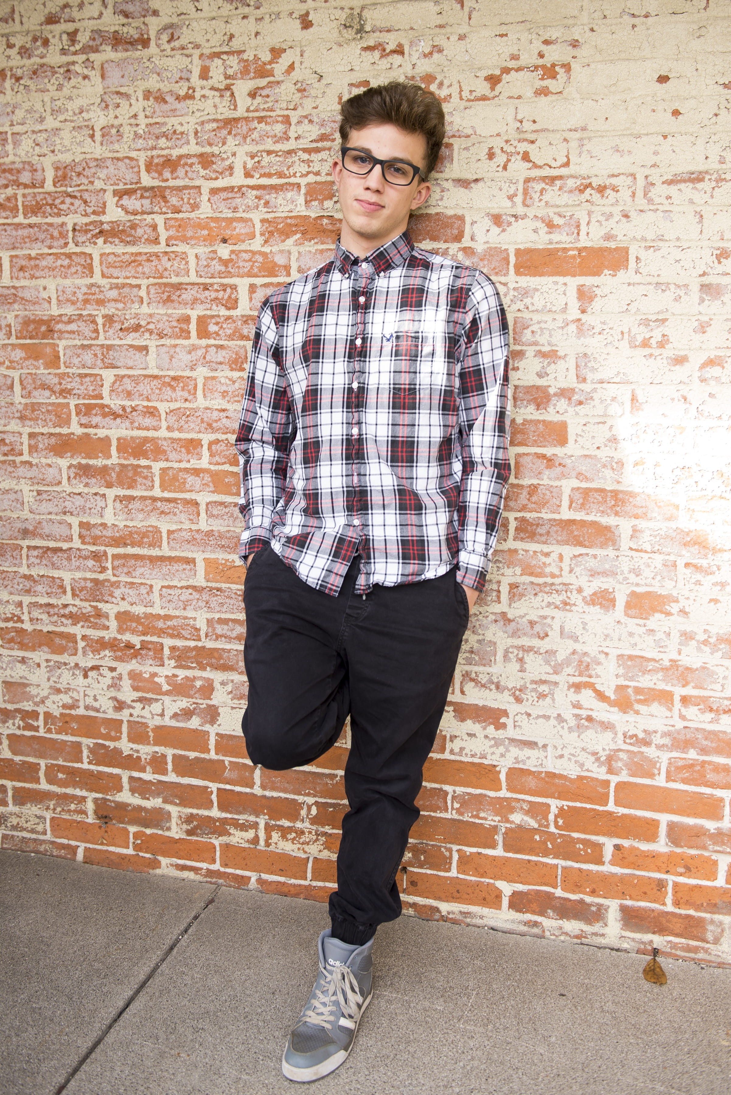brick, looking at camera, wall, fine-looking, real people, shirt, jeans, day, wearing, one person, dress, style, red, pants, cool, leisure activity, wall - building feature, Phone HD Wallpaper
