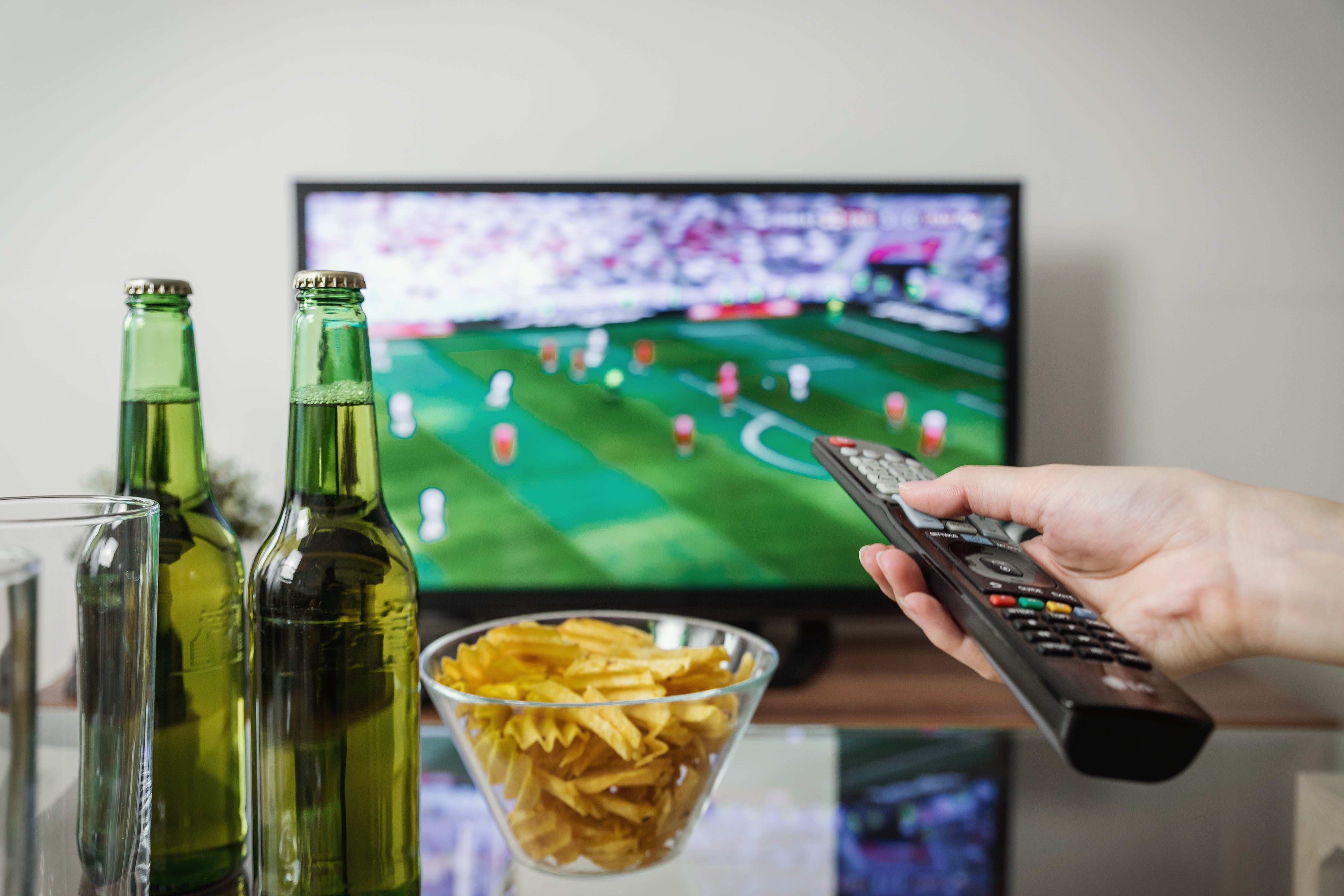 technology, drink, tv, arts culture and entertainment, food, remote control, food and drink, holding, football, human hand, adult, 5K, remote, human body part, HD Wallpaper