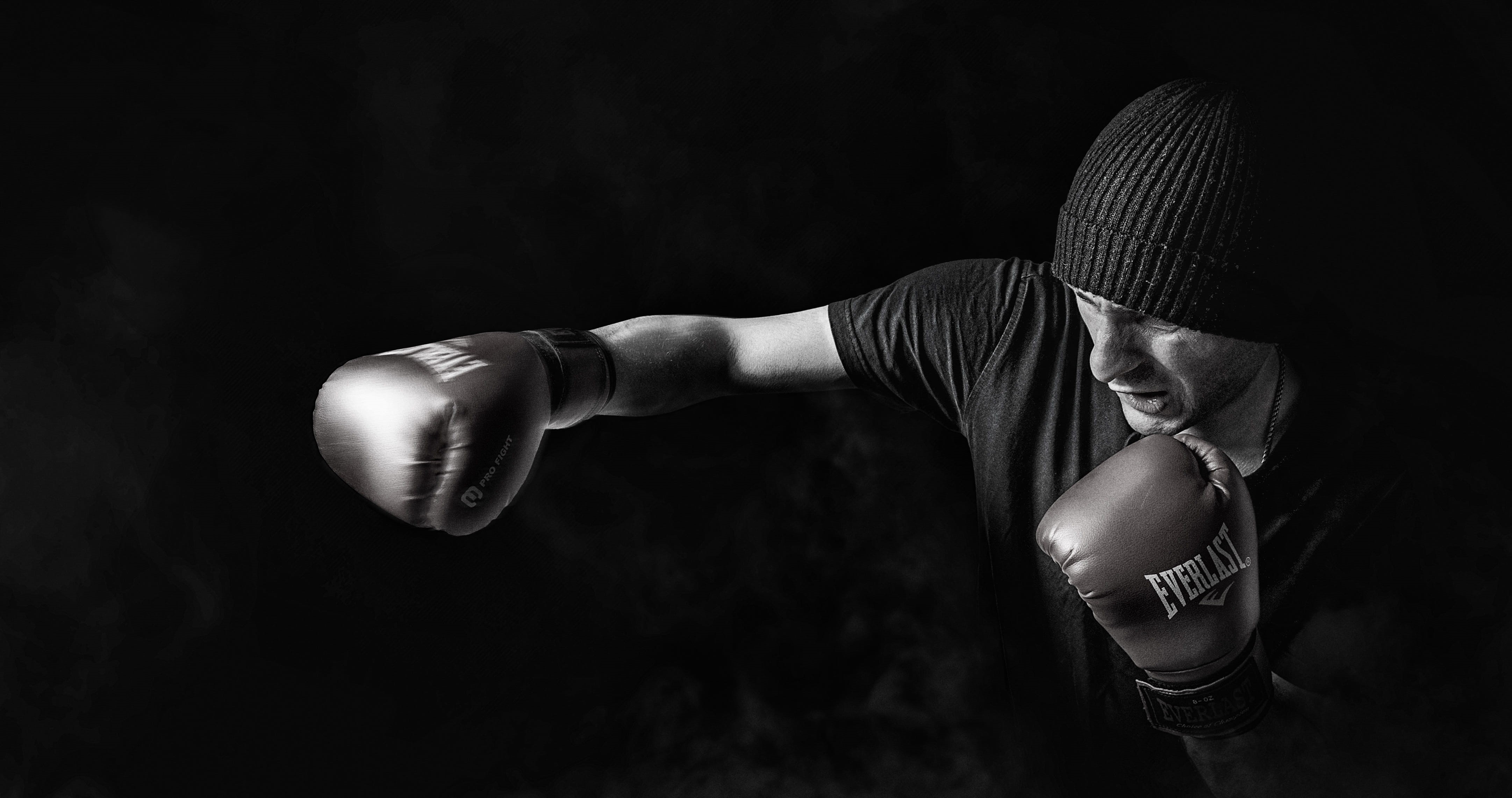 fist, indoors, 4K, bonnet, boxer, combat sport, black-and-white, male, motion, conflict, training, force, fighter, punching, human body part, fighting, HD Wallpaper