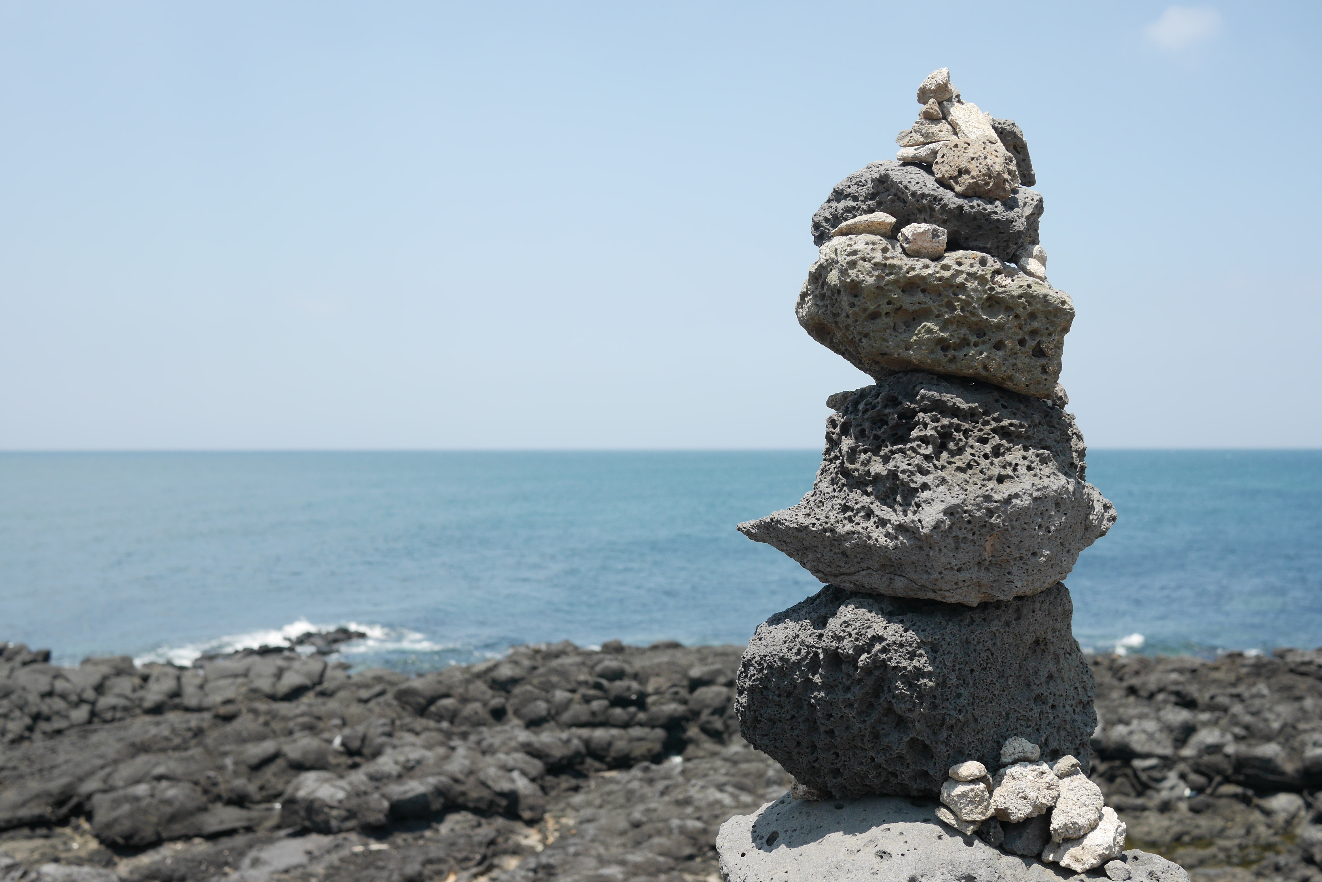 water, blue sea, island, body, travel, sea, land, republic of korea, stone, pebble, summer, rock, landscape, nature, tranquil scene, jeju island, horizon over water, HD Wallpaper