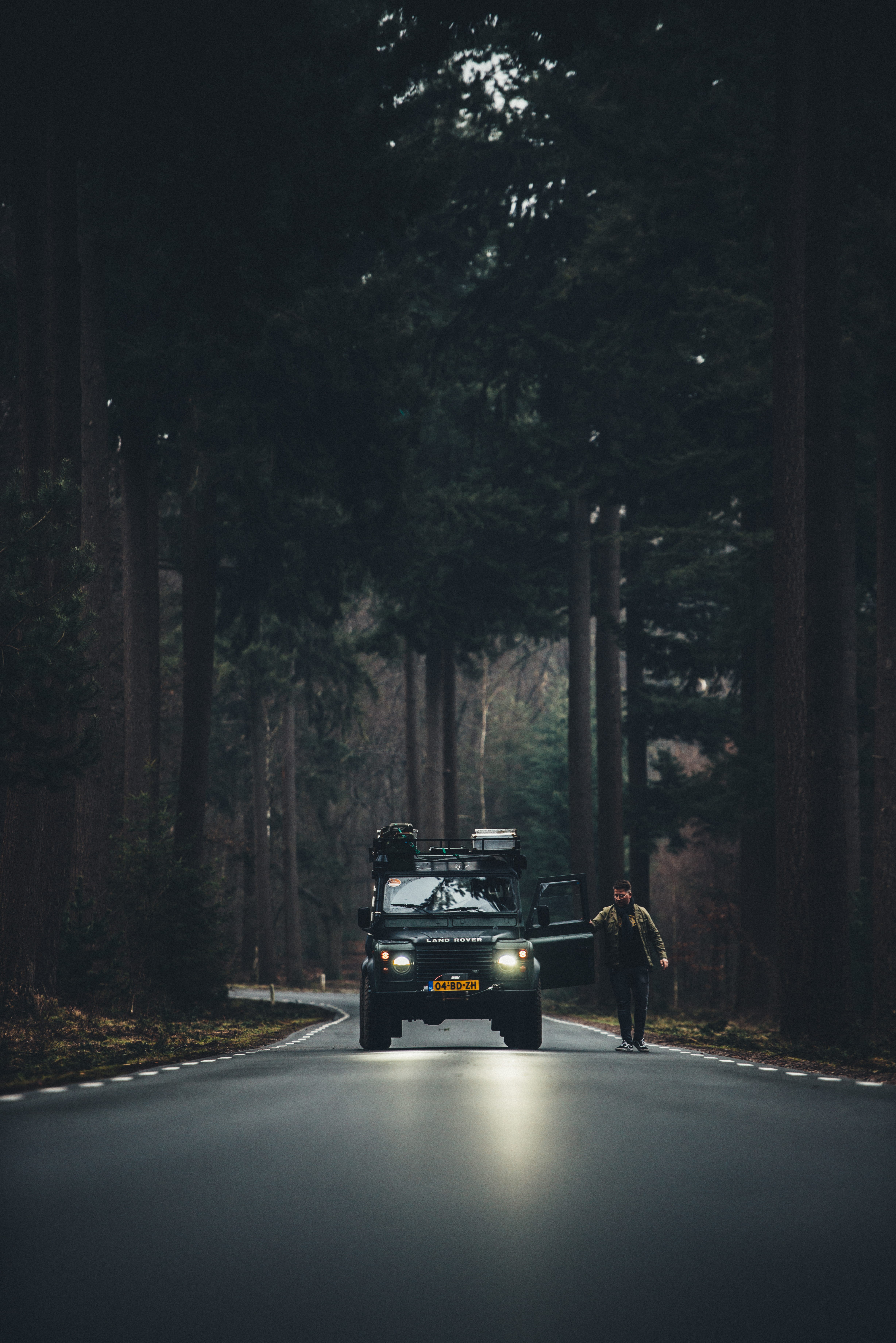 men, plant, land, jacket, road, brown, real people, standing, road trip, light, land vehicle, beside, tree, tree trunk, transportation, rover, nature, outdoors, Phone HD Wallpaper