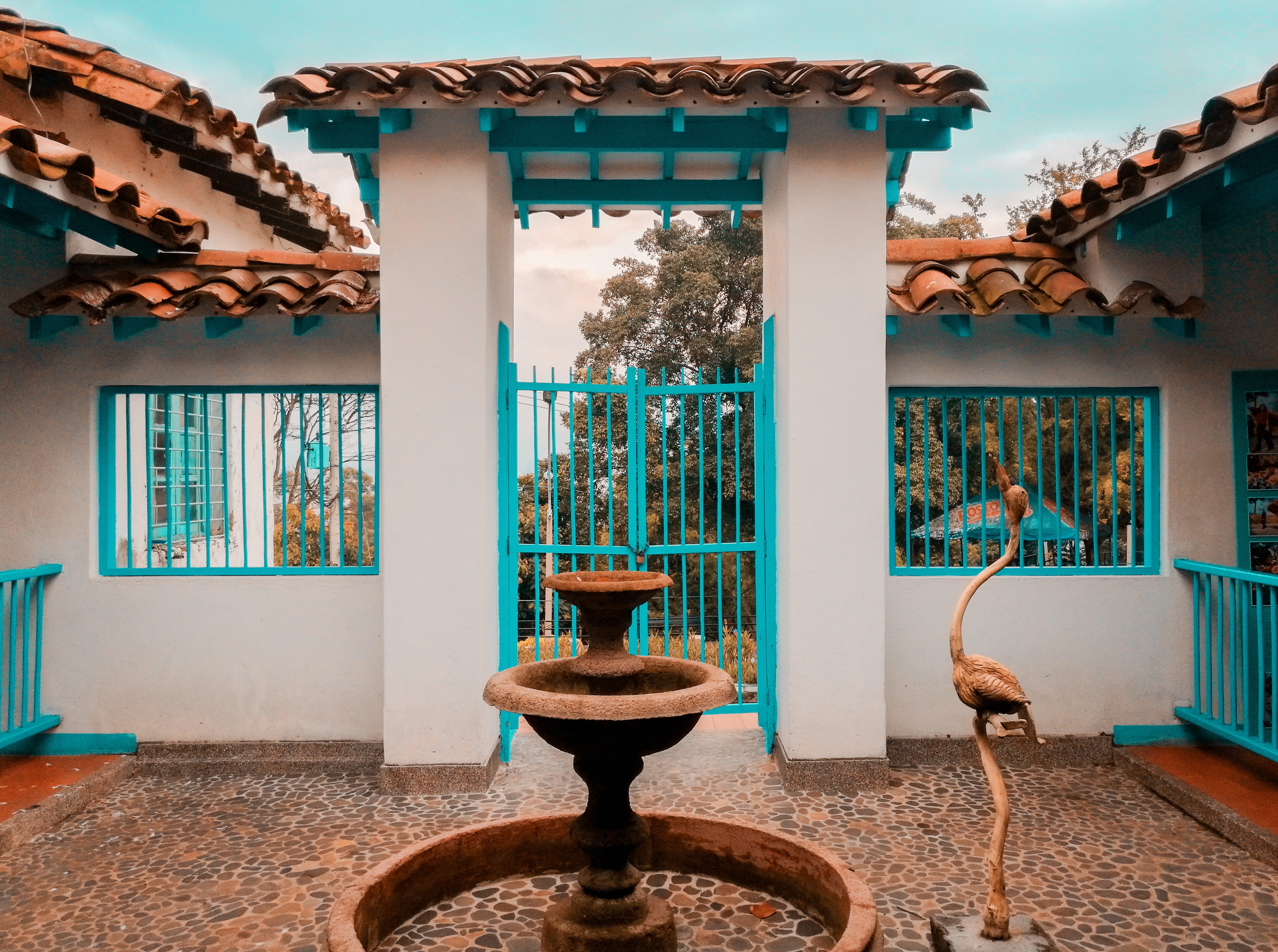 metal, colombia, framed, fountain, pueblito, wall - building feature, teal and orange, built structure, day, building exterior, medellín, statue, art and craft, HD Wallpaper