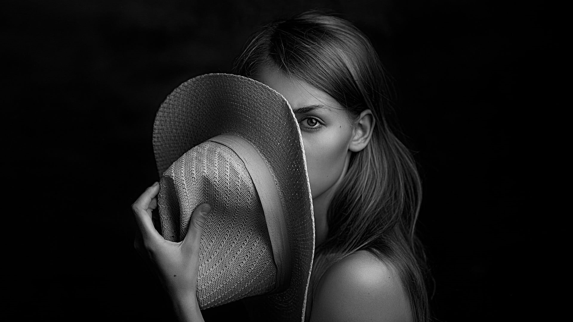black background, child, bare shoulders, clothing, covering face, emotion, hands, holding, hairstyle, monochrome, face, hat, females, women, young adult, HD Wallpaper
