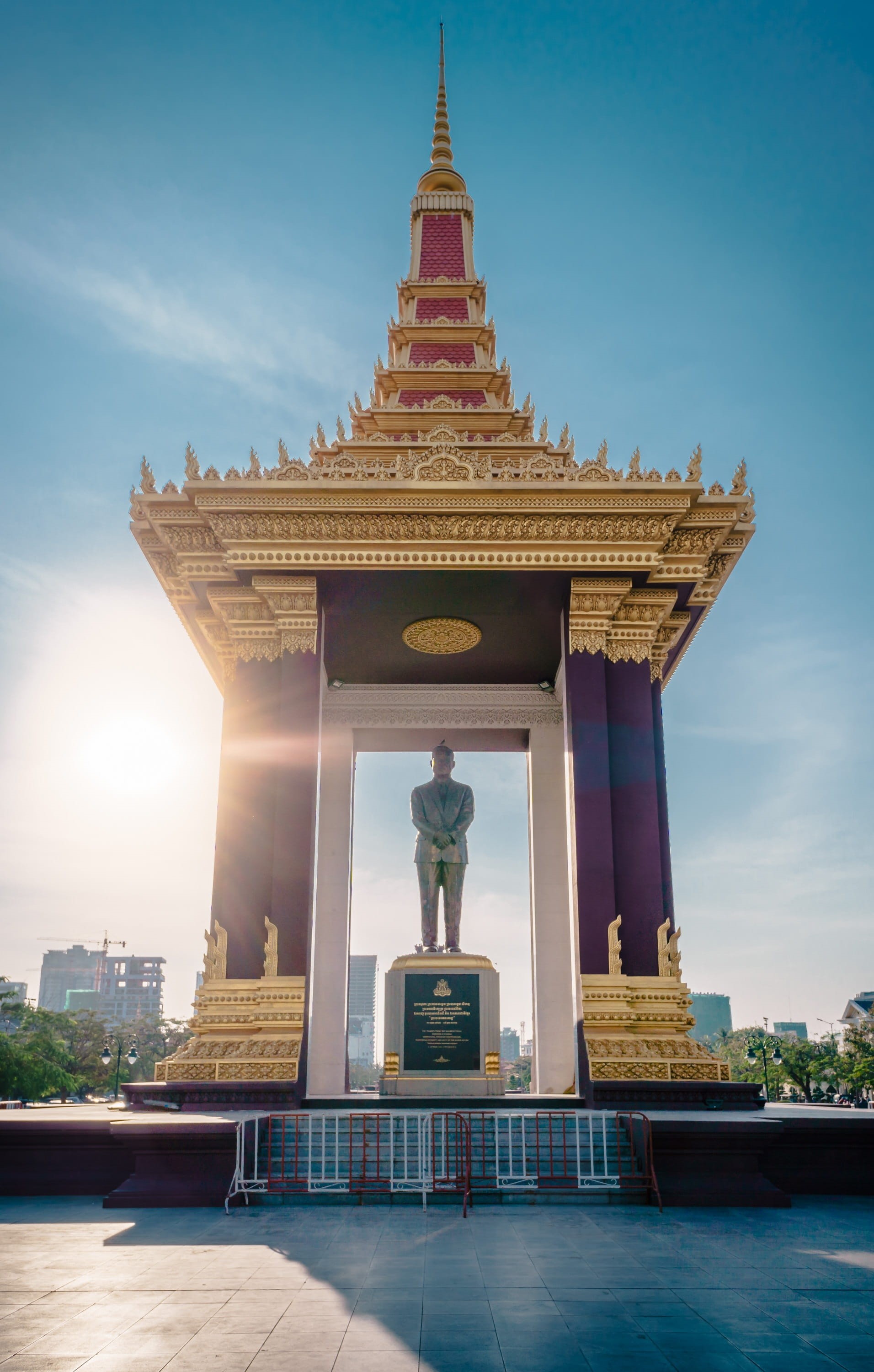 penh, phnom, gold colored, independence square, afternoon, building exterior, statue, nature, art and craft, building, place of worship, travel destinations, Phone HD Wallpaper