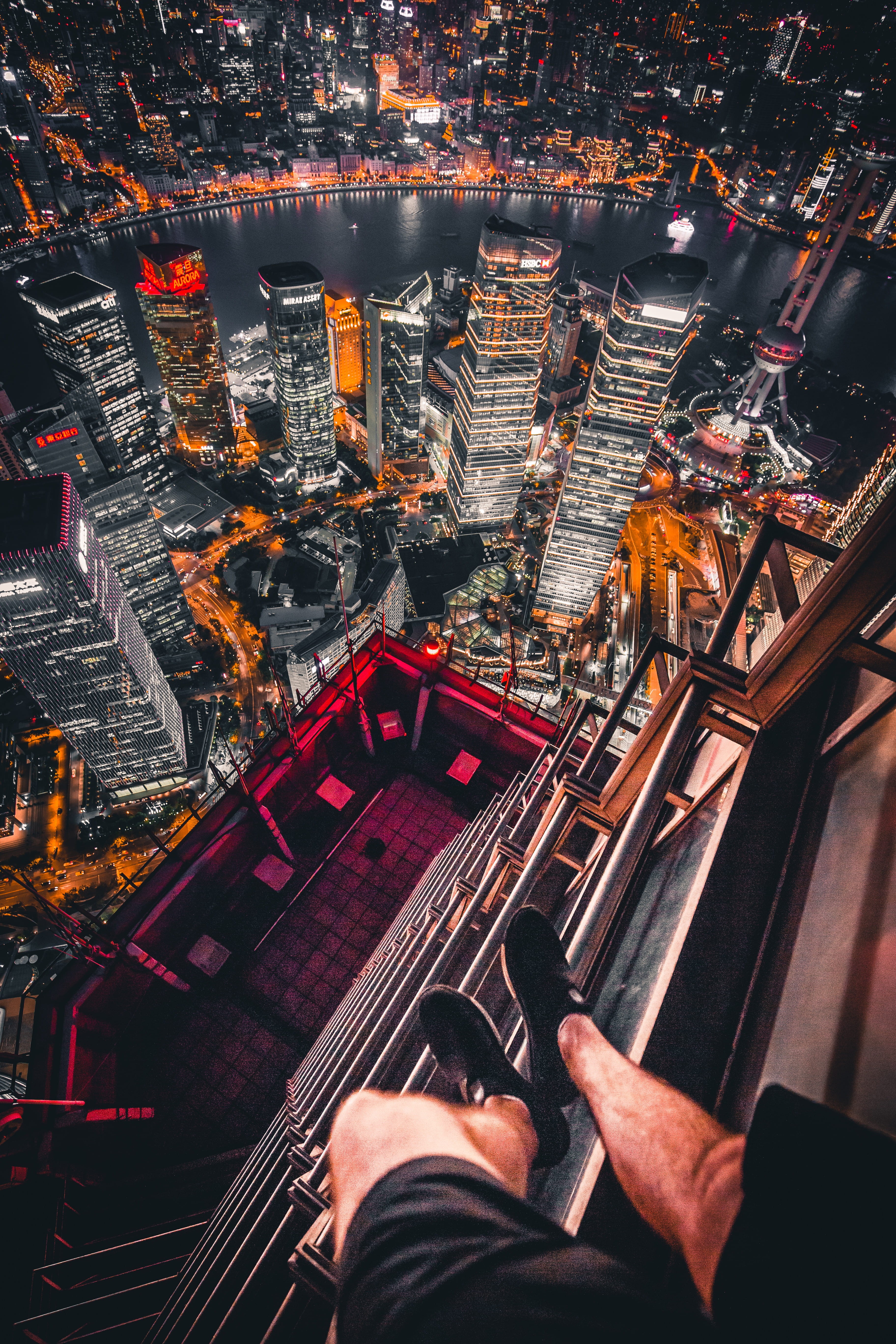 leisure activity, human body part, daredevil, cityscape, architecture, rooftop, high angle view, urban, buildings, view, aerial view, extreme, real people, Phone HD Wallpaper