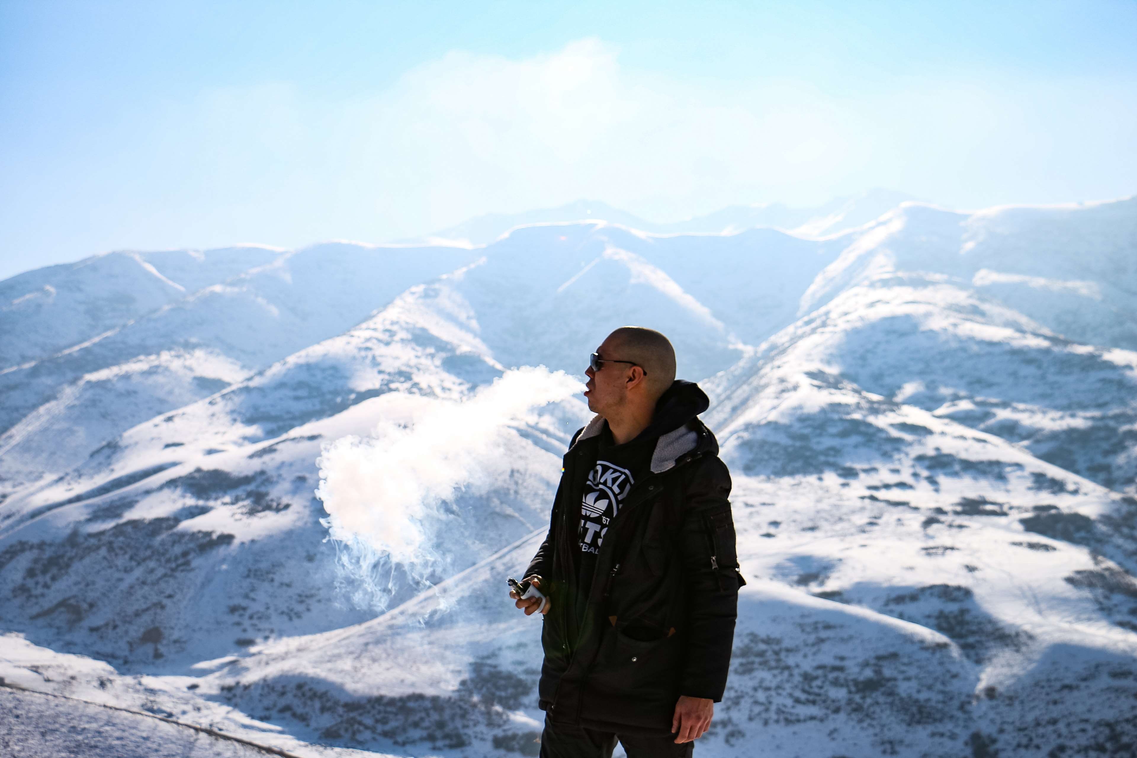 winter, leisure activity, man smoking, real people, scenics - nature, three quarter length, front view, nature, cold temperature, standing, snow, snow capped mountains, HD Wallpaper