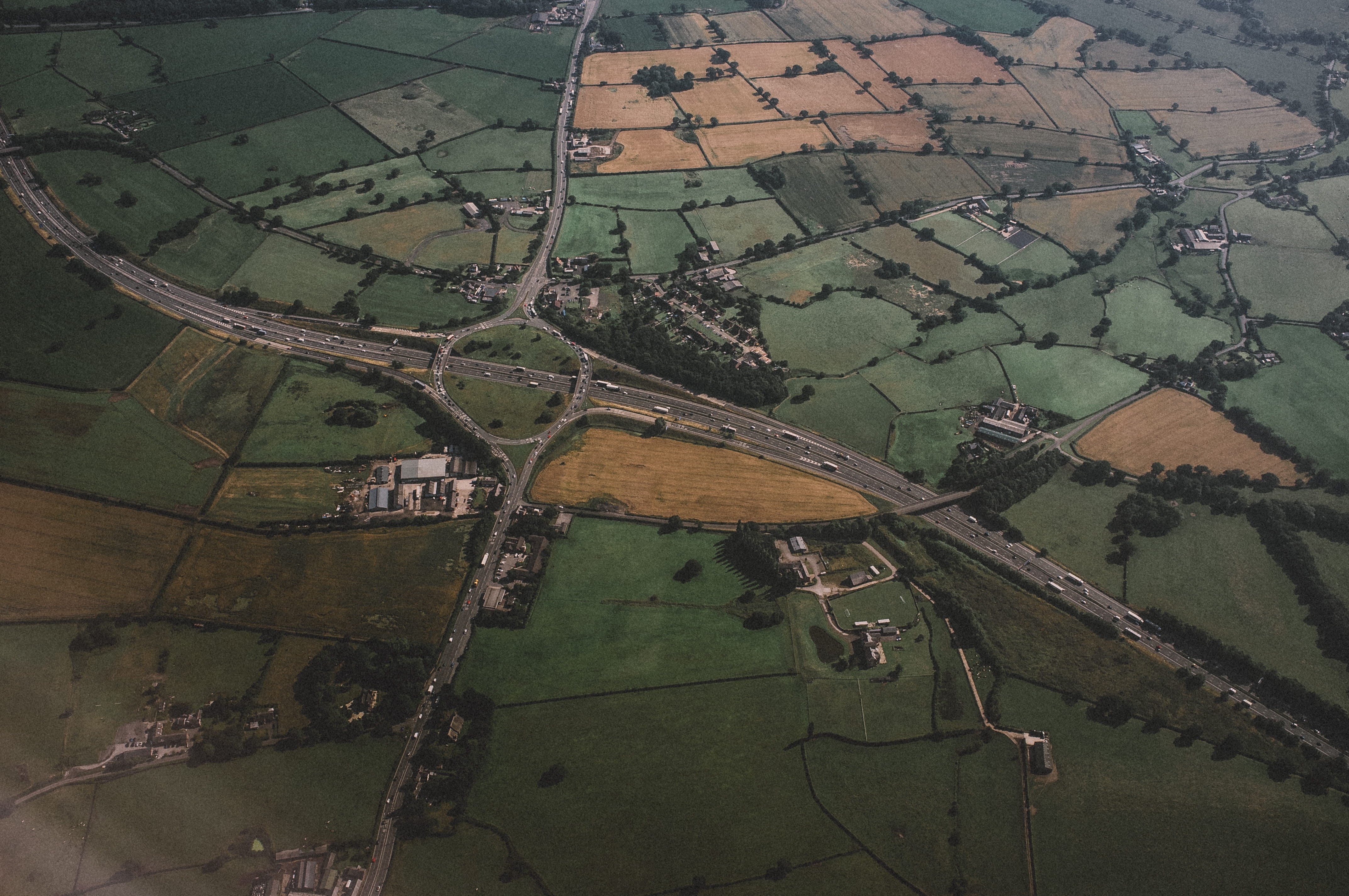 roundabout, day, outdoors, countryside, flying, agriculture, nature, green, environment, field, concrete, patchwork landscape, mid-Air, aerial View, tranquility, HD Wallpaper
