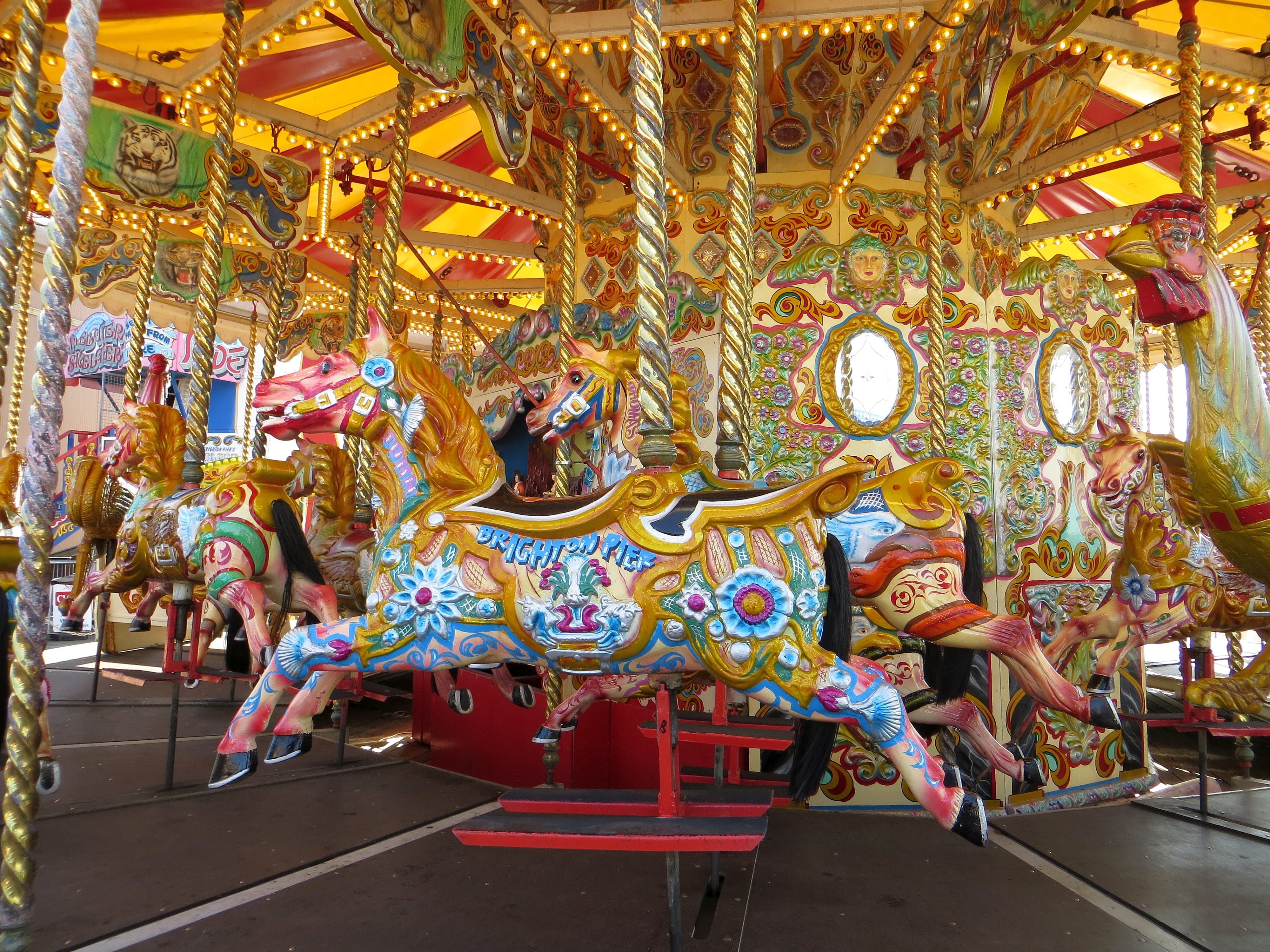 childhood, carousel, ride, fun, sculpture, fair, pier, outdoors, representation, brown, built structure, outdoor, arts culture and entertainment, 4K, mammal, HD Wallpaper