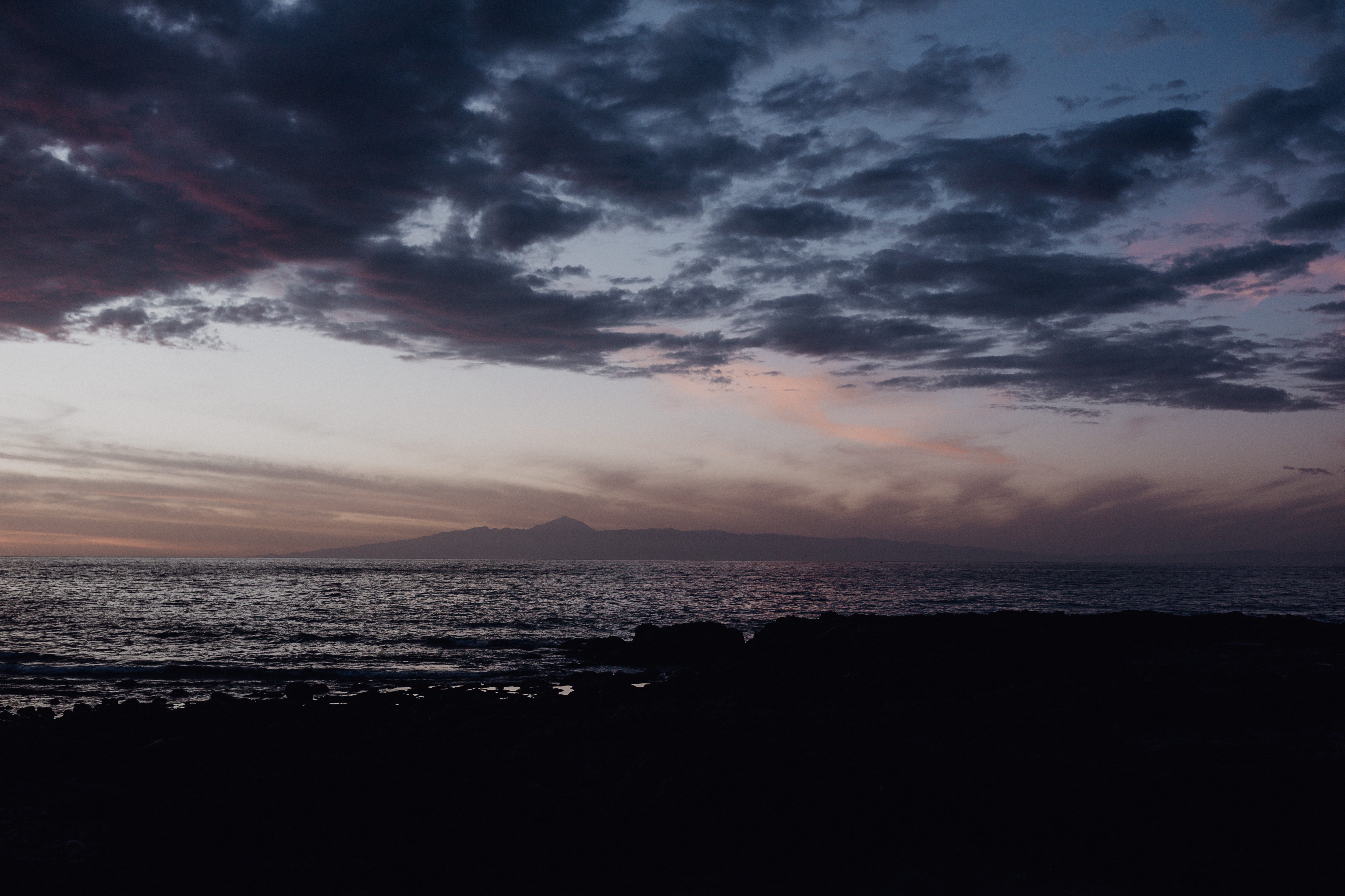 silhouette, 5K, dusk, beauty in nature, spain, sea, ocean, mountain, nature, tranquility, grancanaria, sunset, landscape, outdoors, water, explore, sky, HD Wallpaper